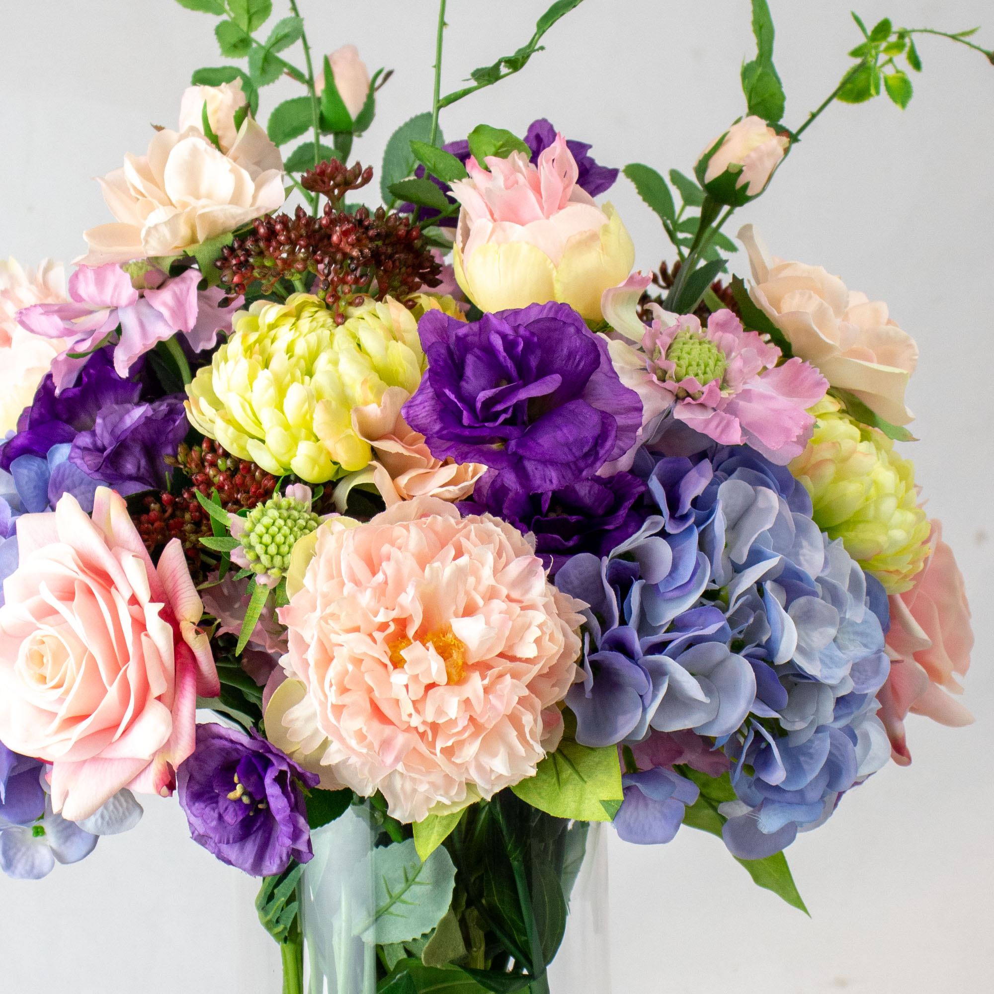 Large Blue and Lavender Mixed Floral Arrangement in Cylindrical Glass Vase – 70cm