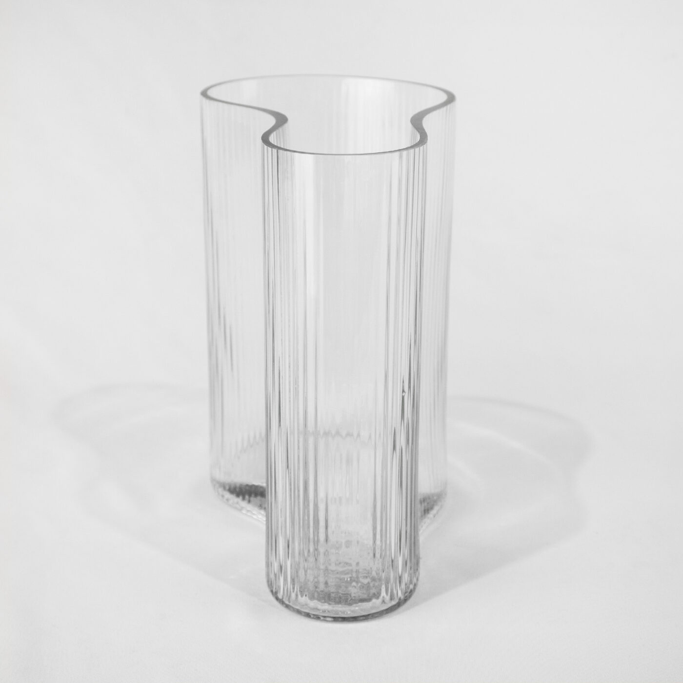Curved Architectural vase with vertical ribs - side