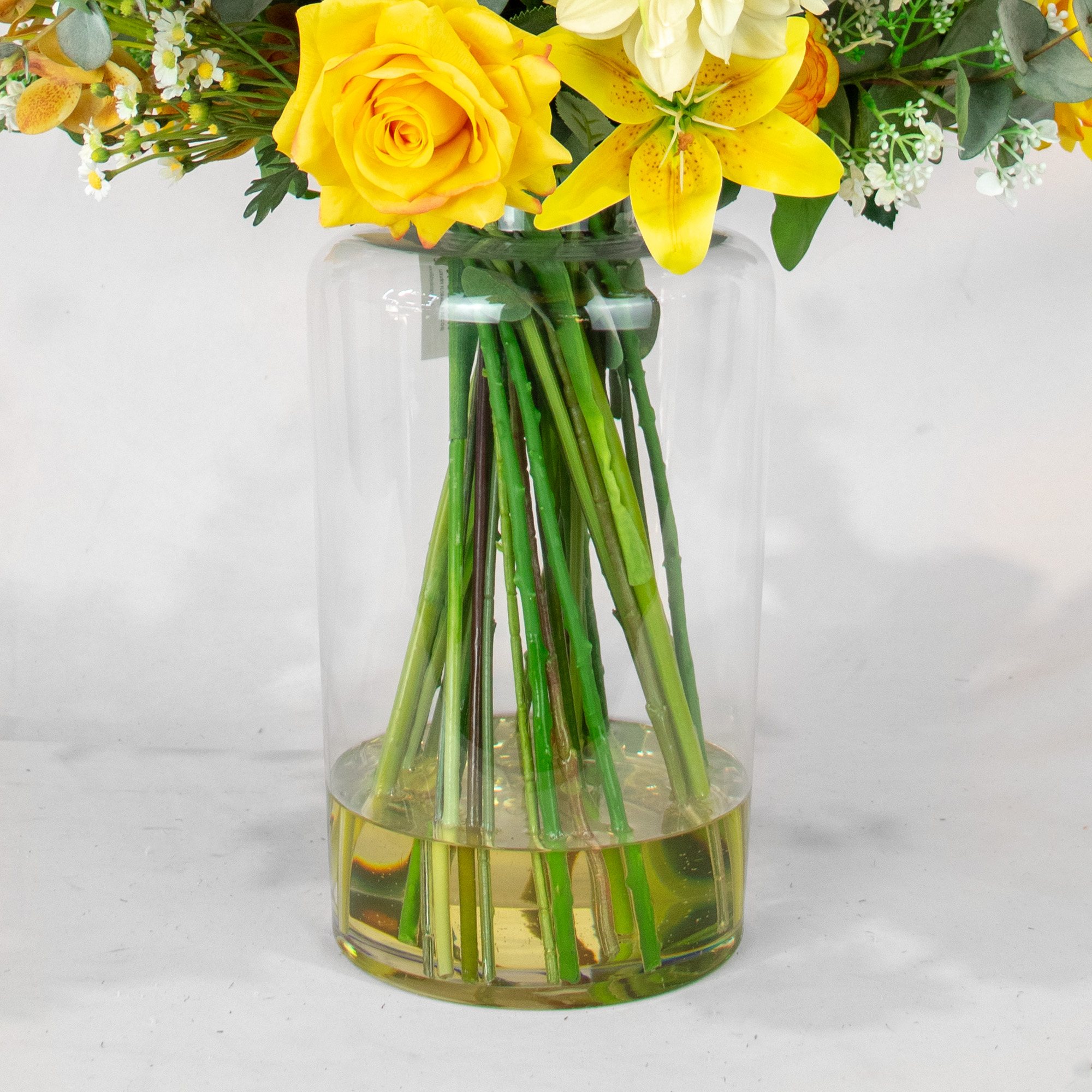 MIXED YELLOW CREAM ARRANGEMENT WITH EUCALYPTUS JAR VASE