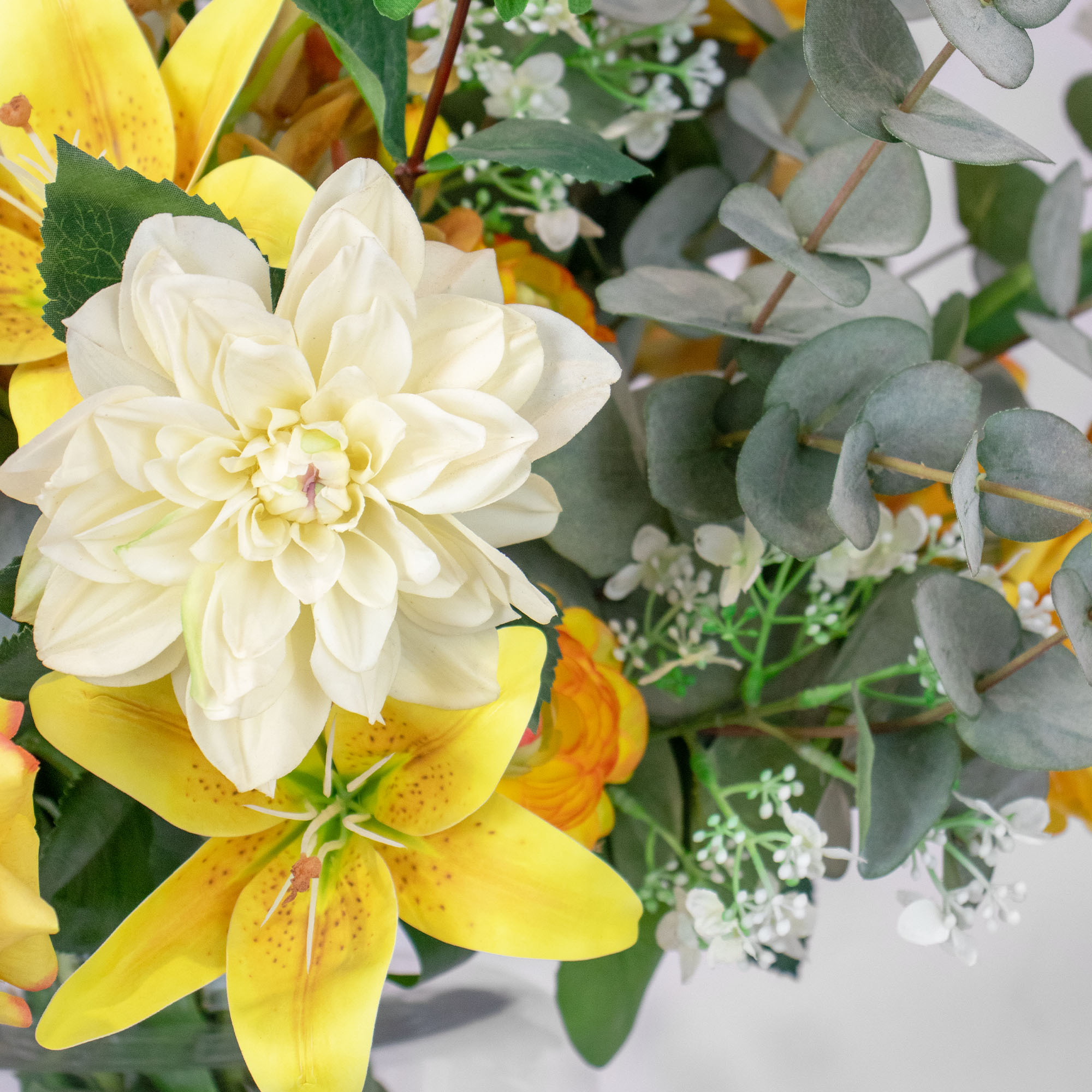 MIXED YELLOW CREAM ARRANGEMENT WITH EUCALYPTUS JAR VASE