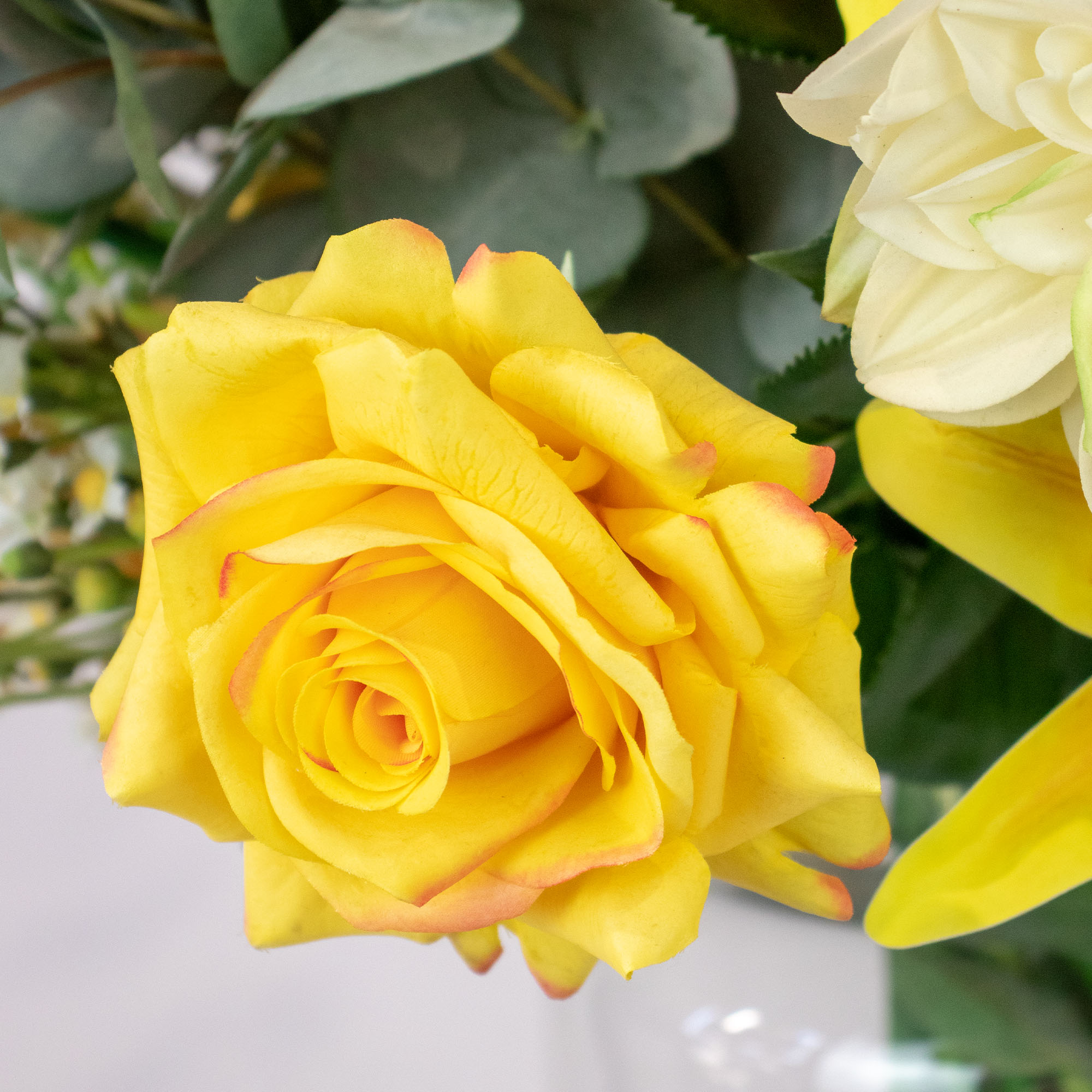 MIXED YELLOW CREAM ARRANGEMENT WITH EUCALYPTUS JAR VASE