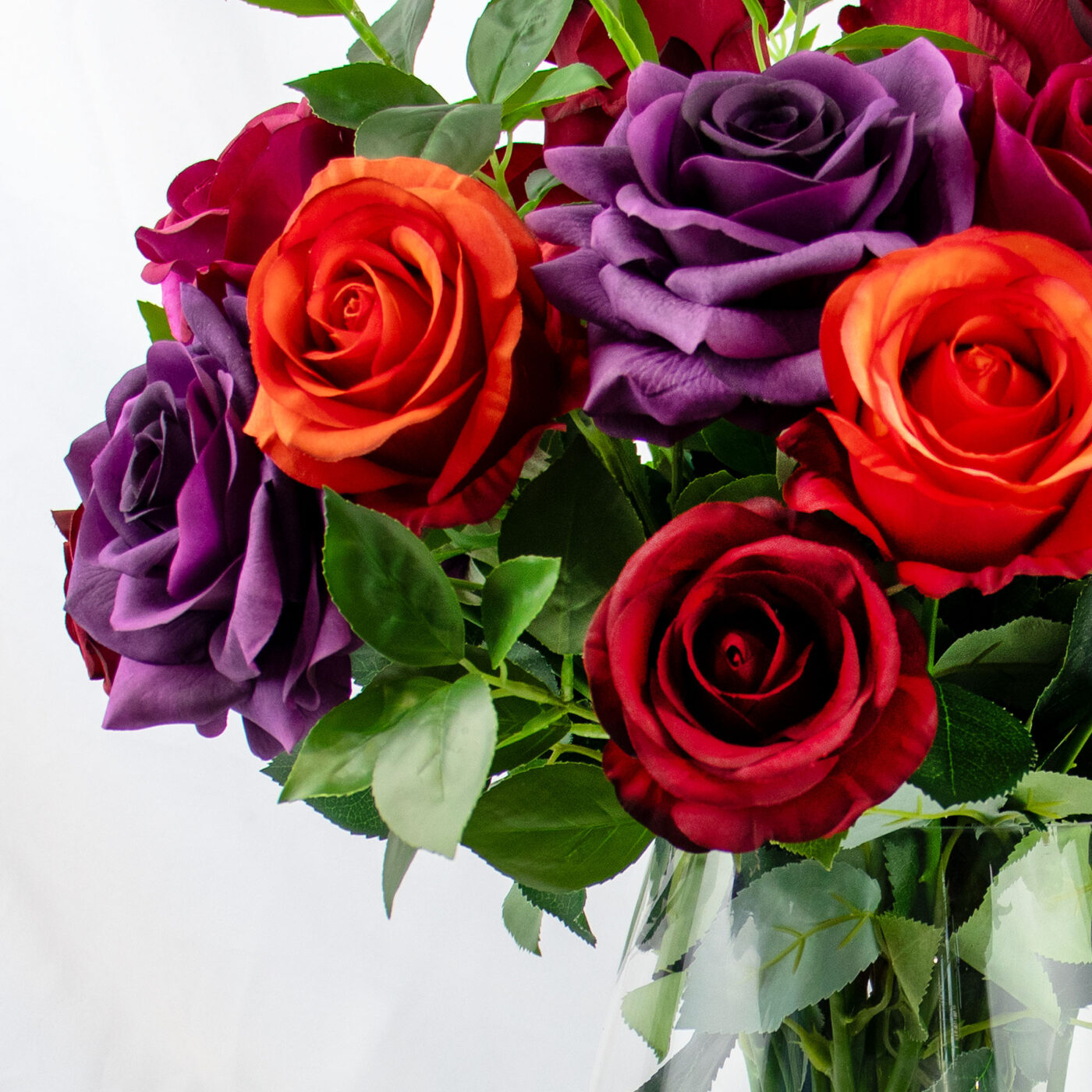 ROSES RED BEAUTY AND PURPLE IN GLASS VASE