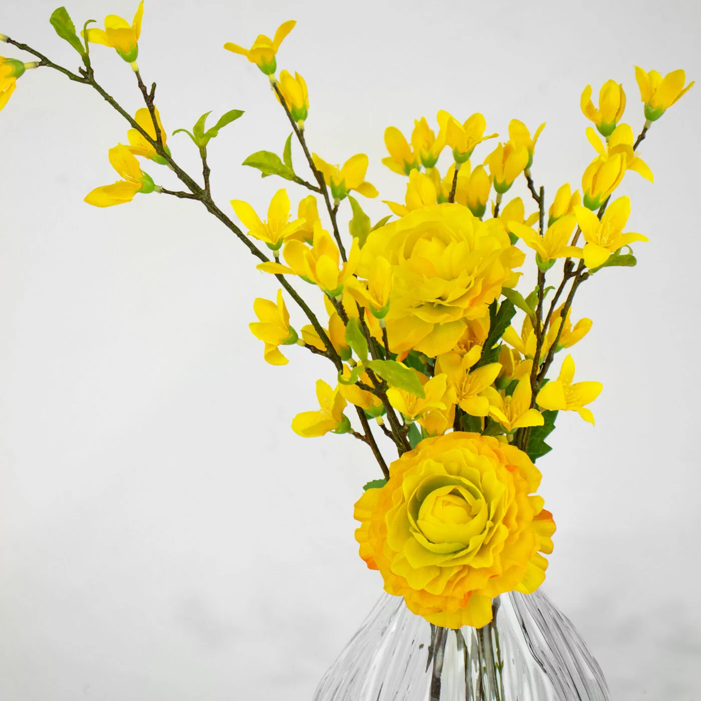 FORSYTHIA YELLOW WITH RANANCULUS YELLOW IN LG BUD VASE
