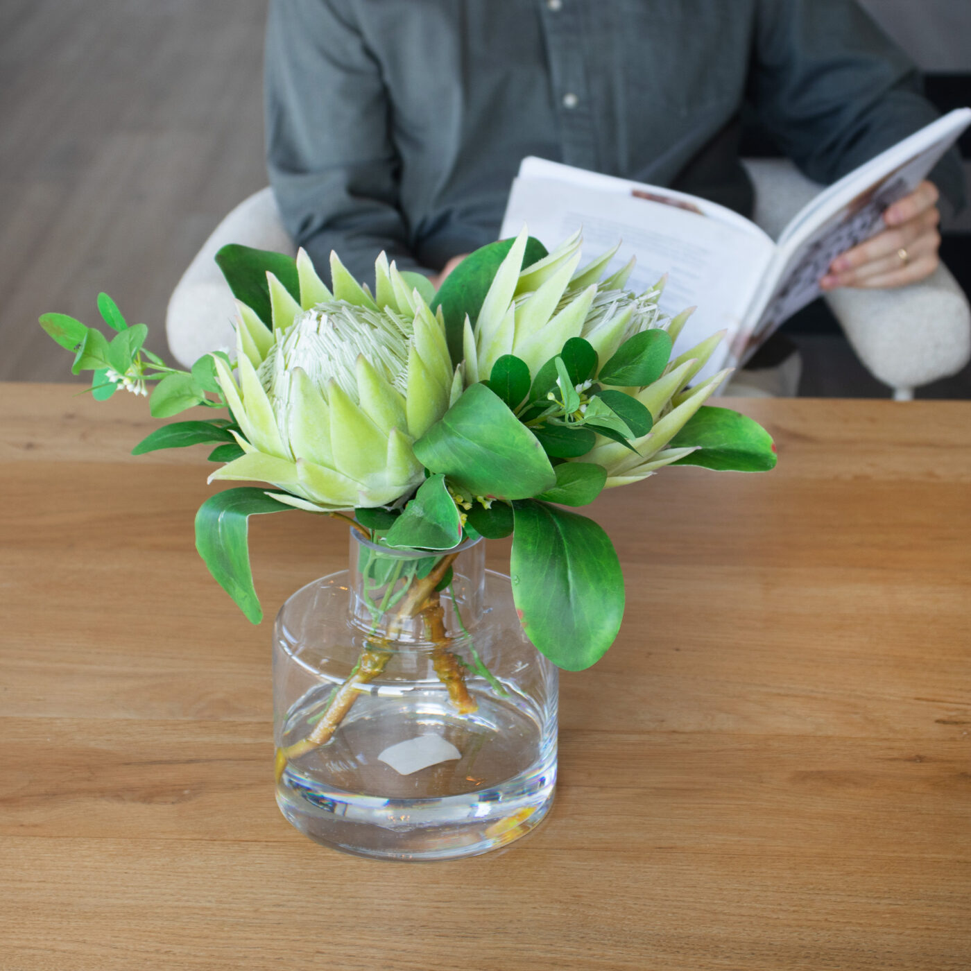 PROTEA GREEN WITH FOLIAGE IN JAR VASE