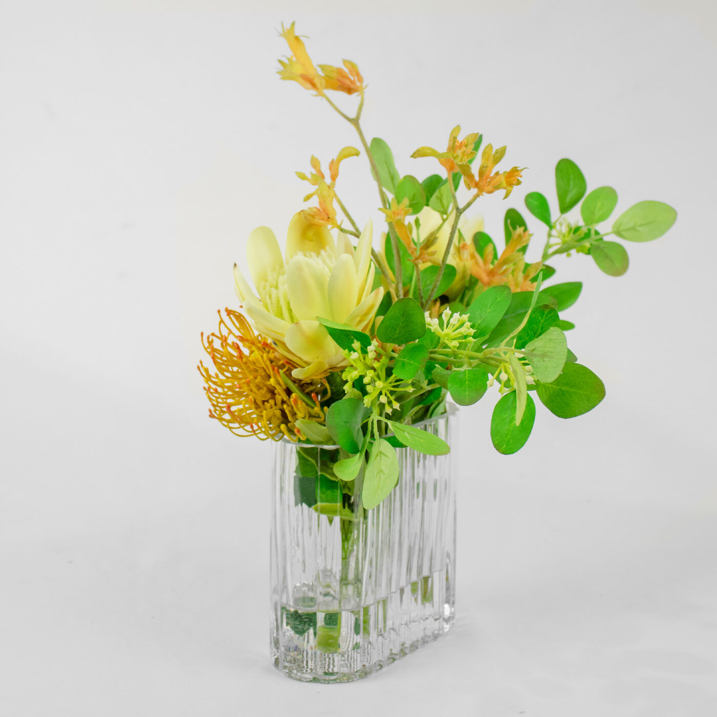 PROTEA YELLOW GREEN WITH FOILAGE IN RECT RIB VASE - Image 3