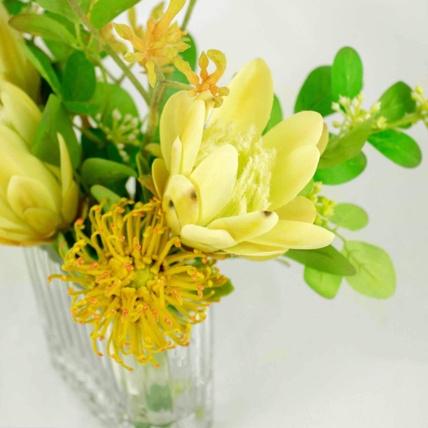 PROTEA YELLOW GREEN WITH FOILAGE IN RECT RIB VASE - Image 2