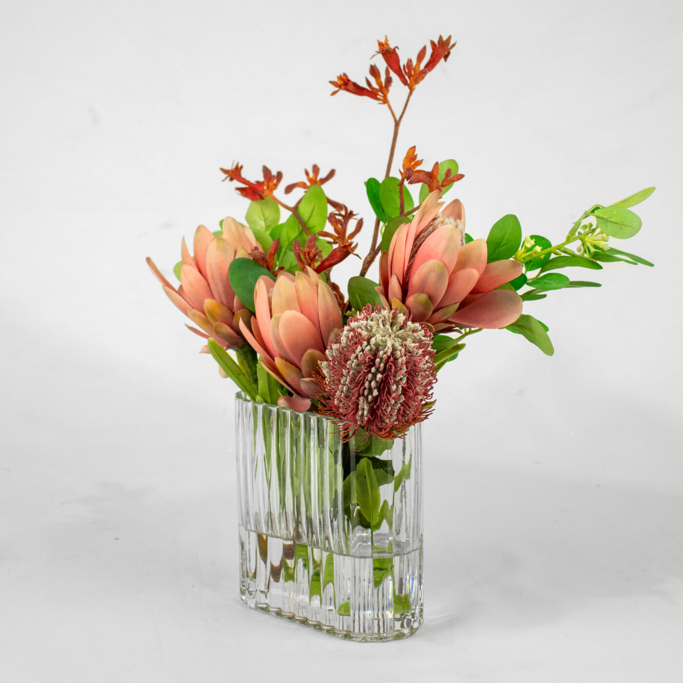 PROTEA CORAL WITH FOILAGE IN SMALL RECT RIB VASE - Image 2