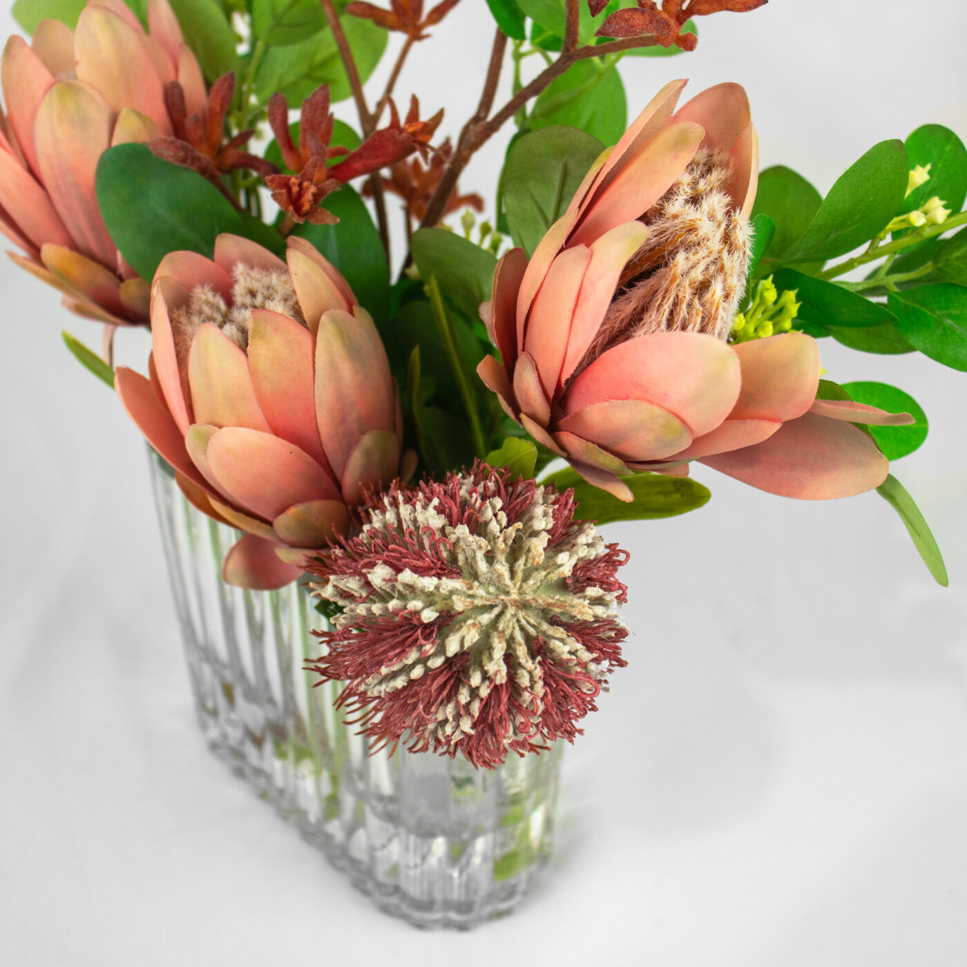 PROTEA CORAL WITH FOILAGE IN SMALL RECT RIB VASE - Image 3
