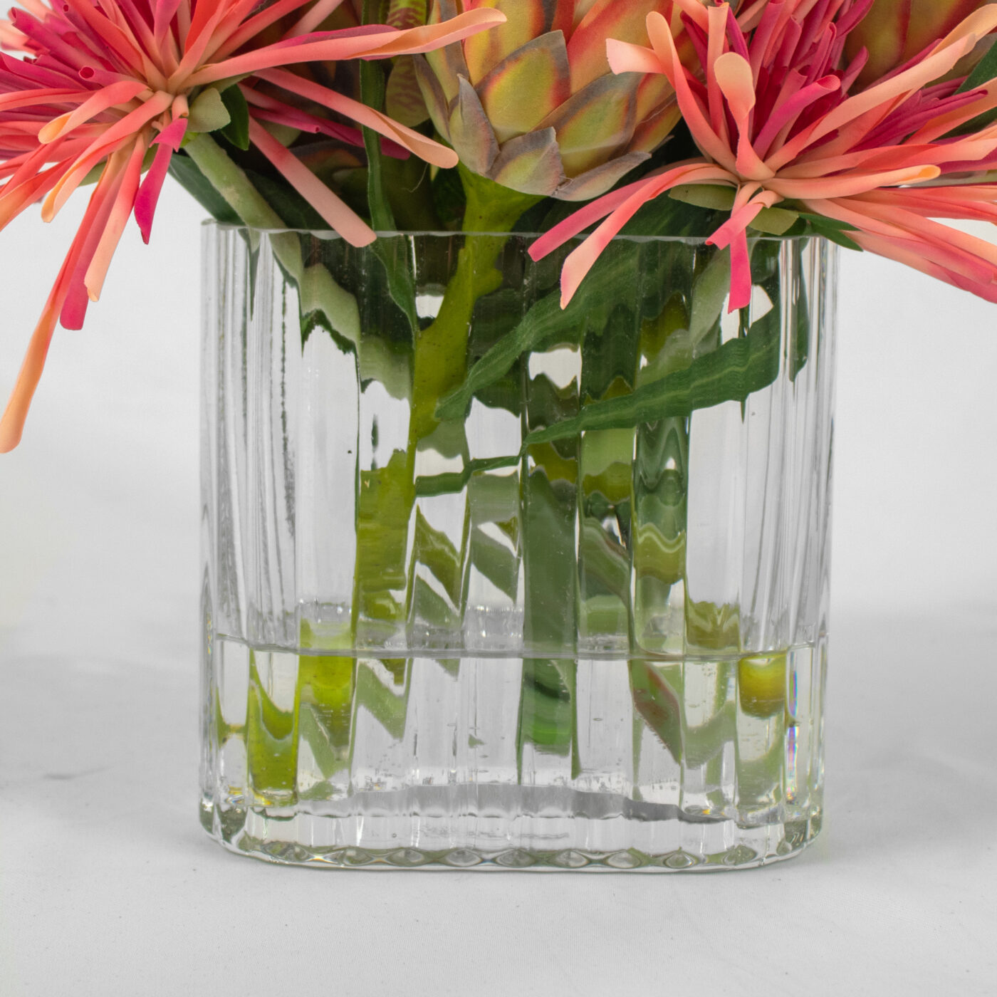 PROTEA RED WITH SPIDER MUM IN SMALL RECT RIB VASE