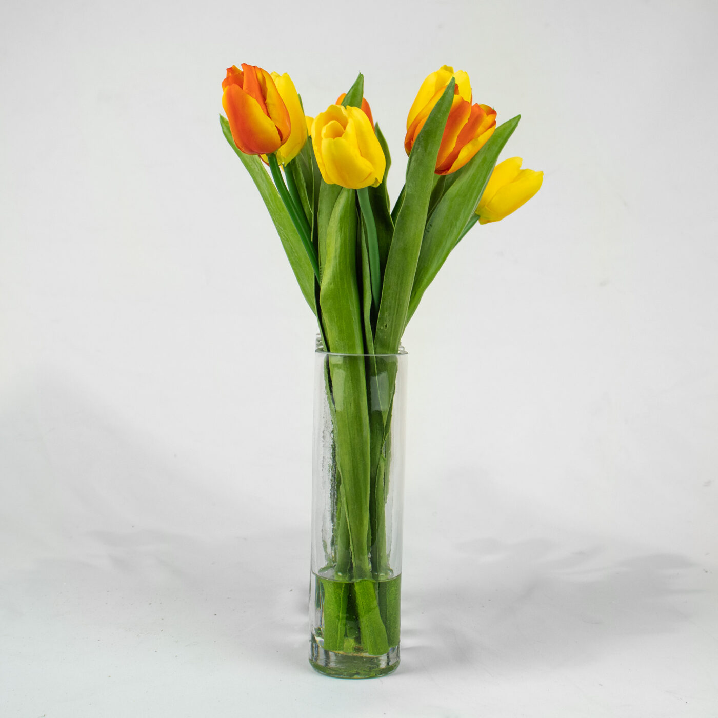 TULIPS YELLOW AND PINK IN RECTANGULAR GLASS VASE