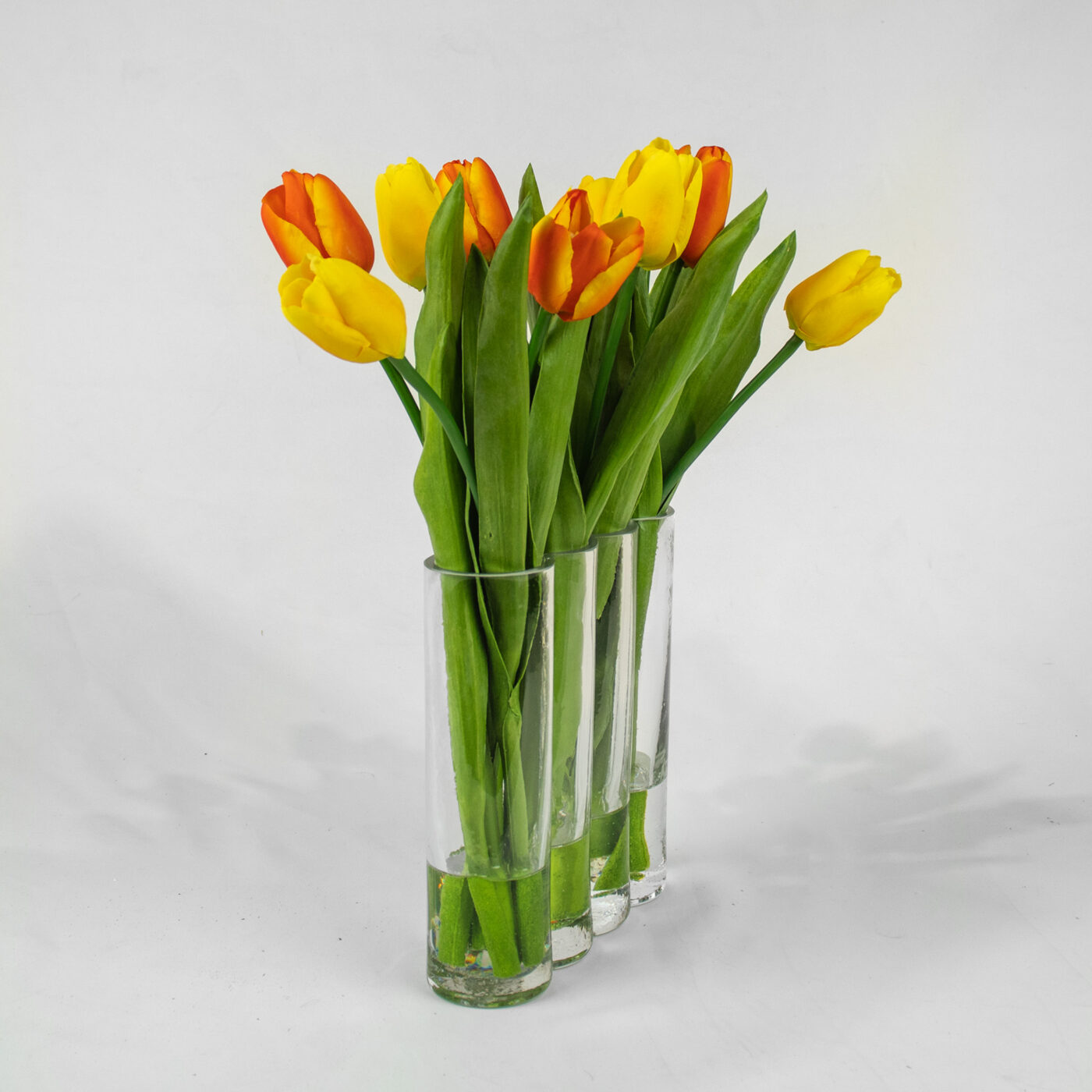 TULIPS YELLOW AND PINK IN RECTANGULAR GLASS VASE