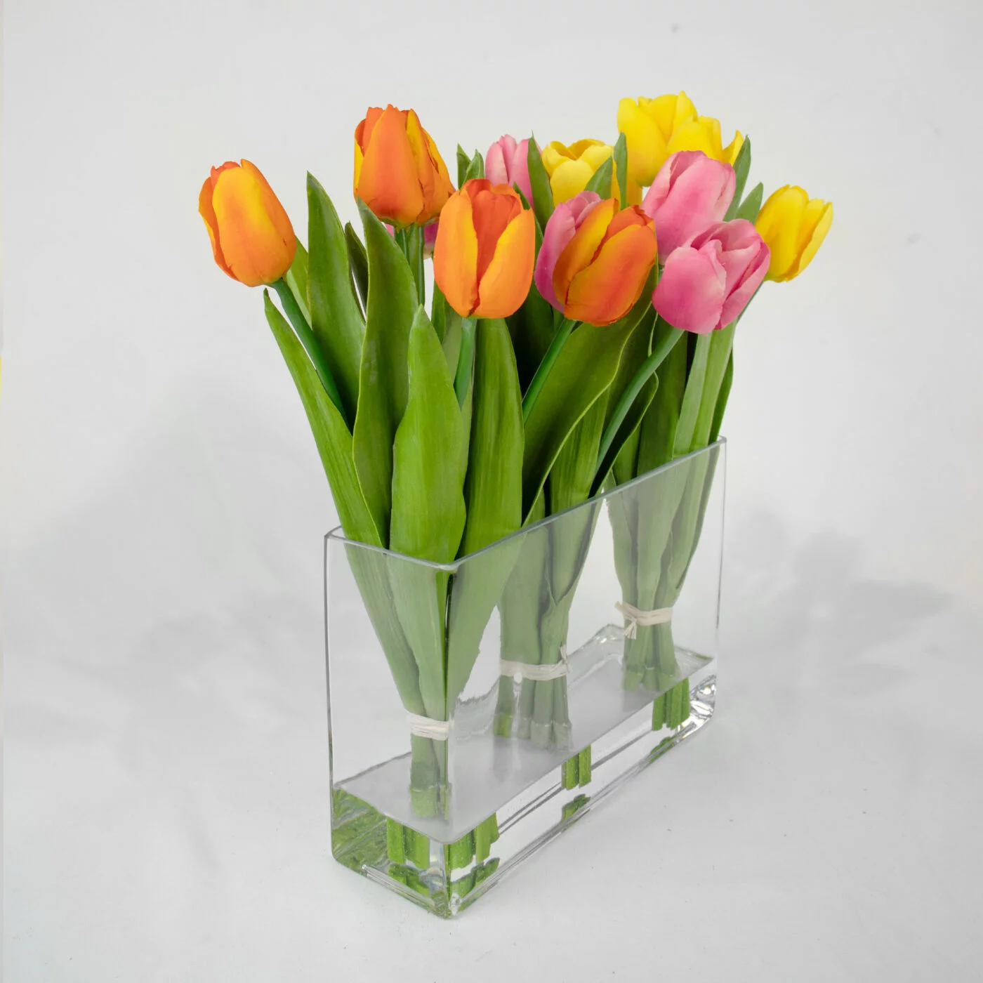 TULIPS ORANGE PINK AND YELLOW IN RECT VASE