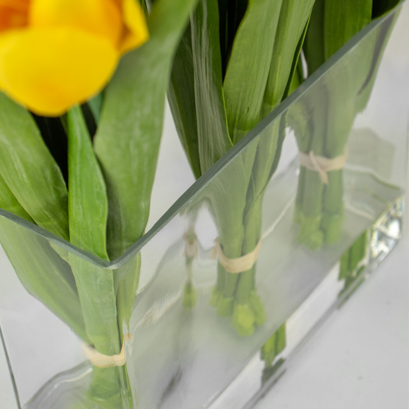 TULIPS ORANGE PINK AND YELLOW IN RECT VASE