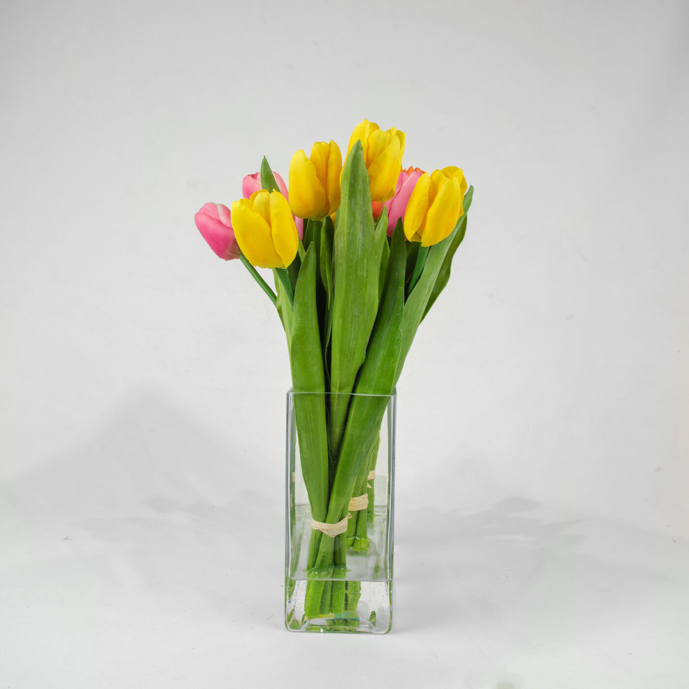TULIPS ORANGE PINK AND YELLOW IN RECT VASE