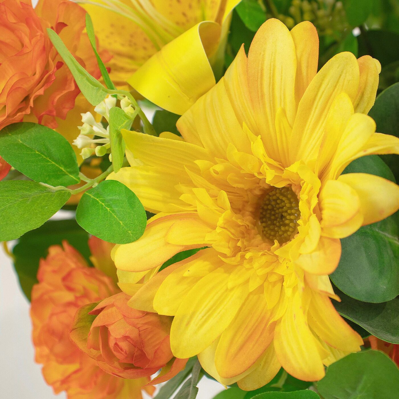 LILY RANUNCULUS ROSE ORANGE AND YELLOW IN GLASS VASE