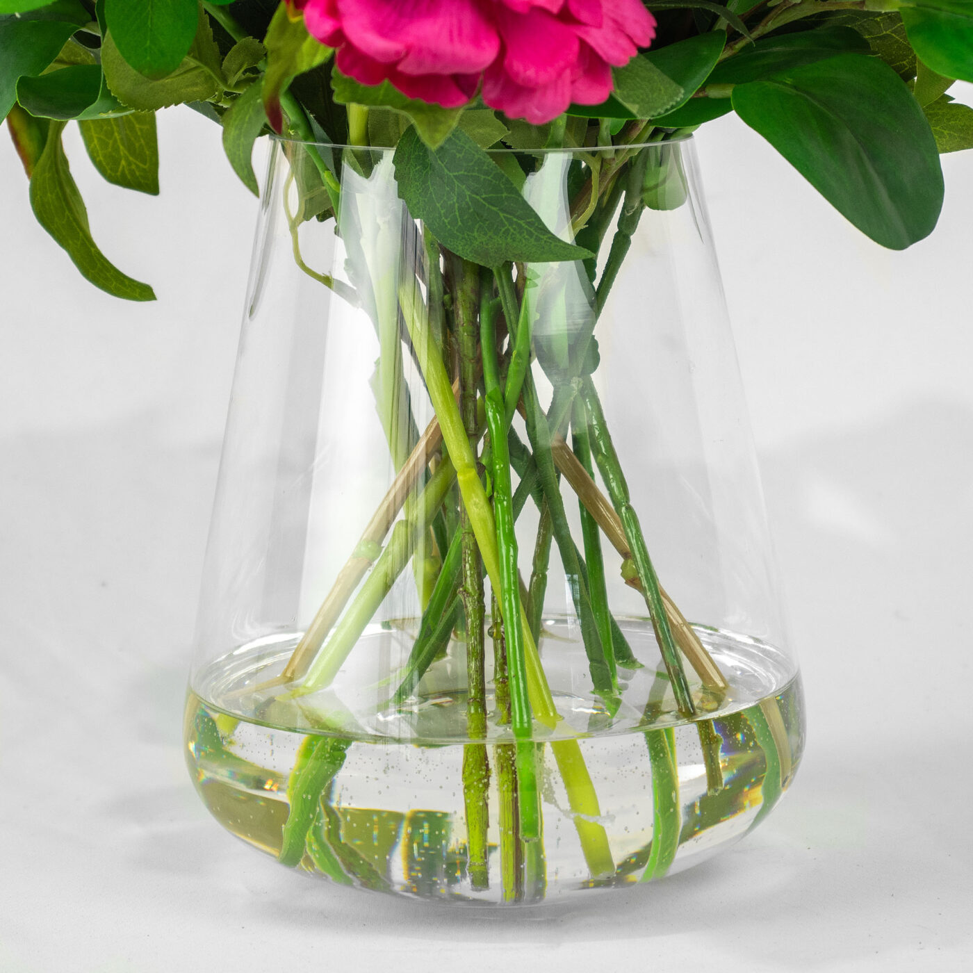 PEONY AND ROSE PINK WITH FOLIAGE IN GLASS VASE
