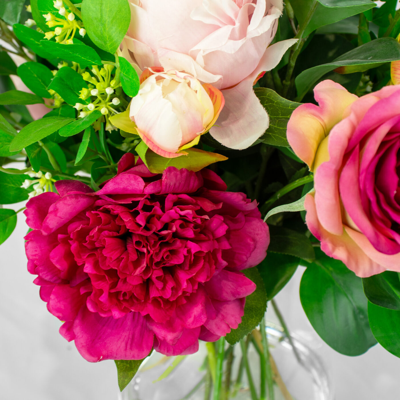 PEONY AND ROSE PINK WITH FOLIAGE IN GLASS VASE
