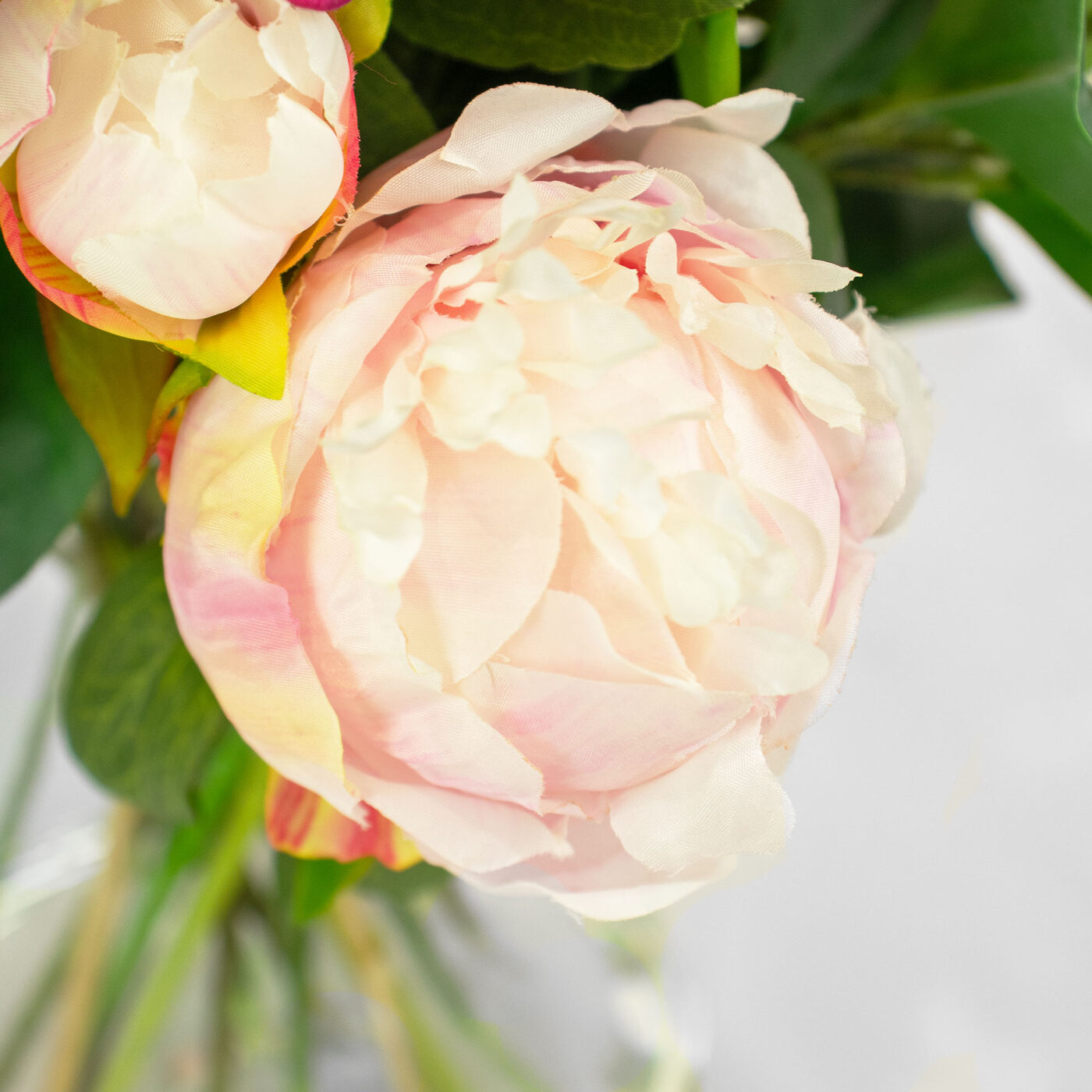 PEONY AND ROSE PINK WITH FOLIAGE IN GLASS VASE