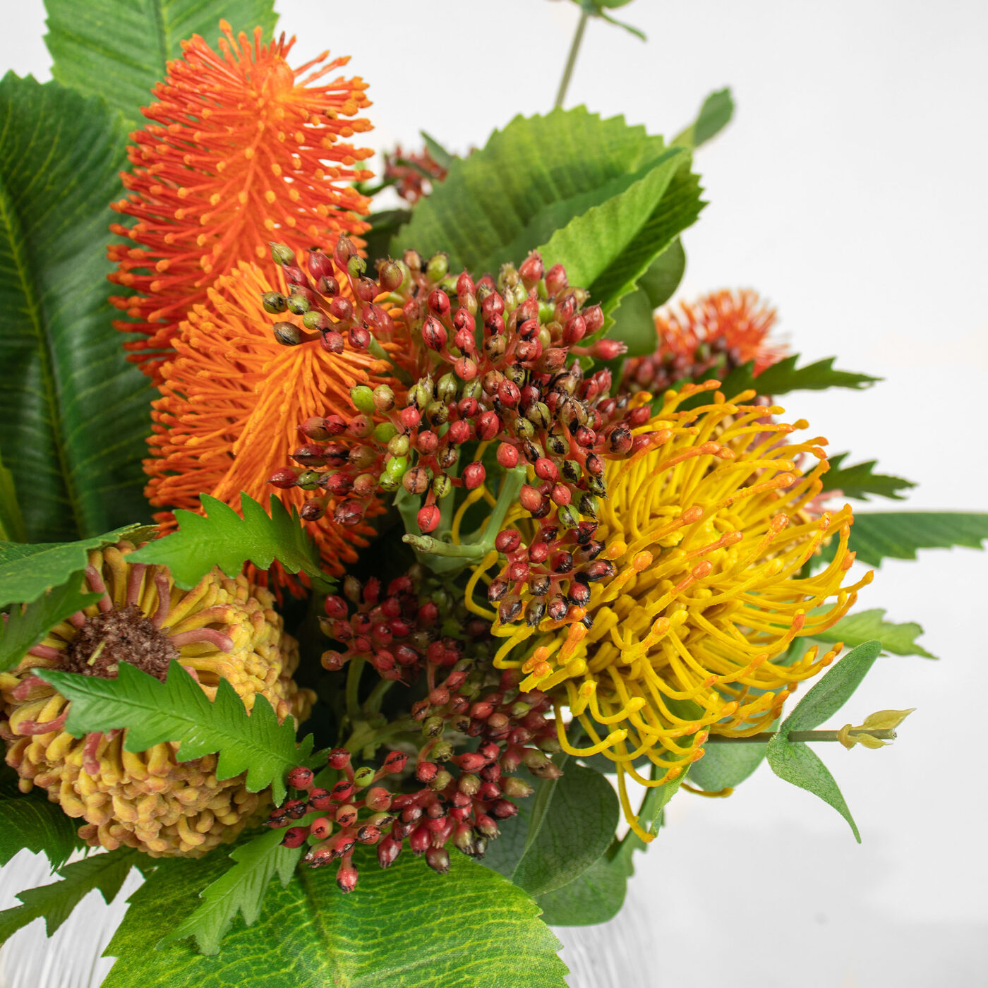 BANKSIA MIX WITH PROTEA IN RIBBED GLASS VASE
