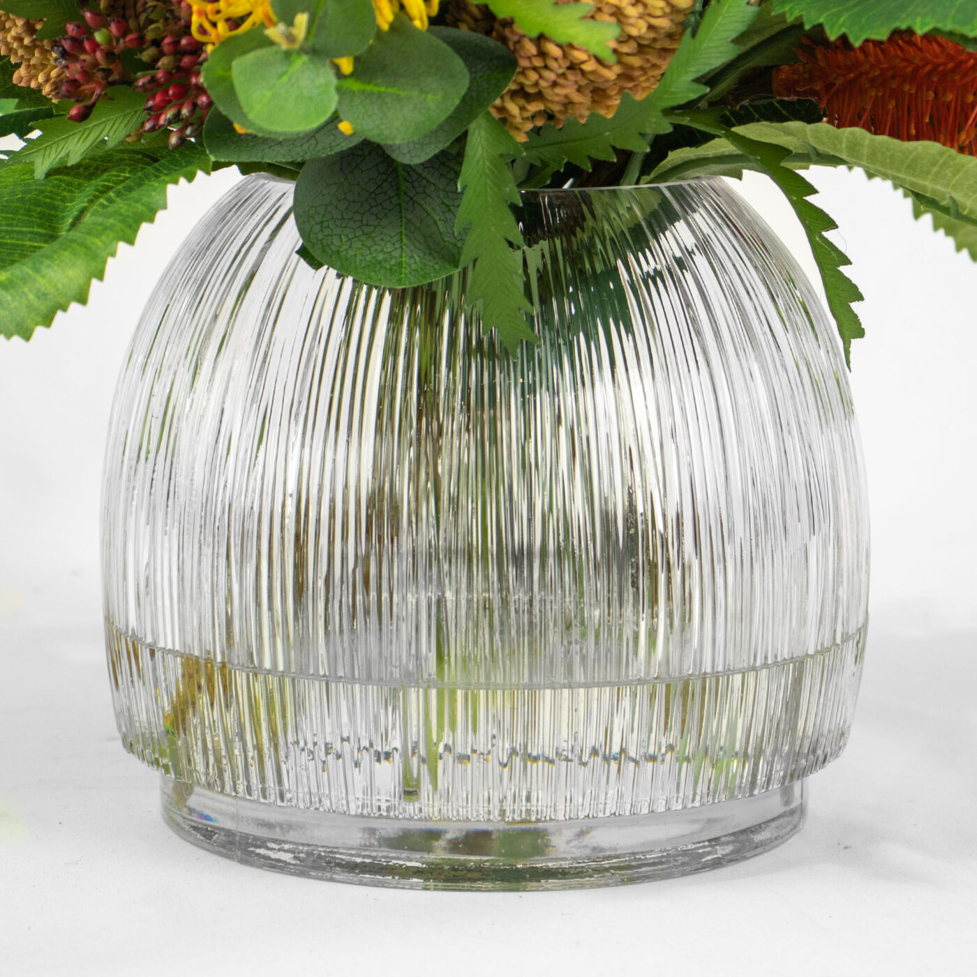 BANKSIA MIX WITH PROTEA IN RIBBED GLASS VASE