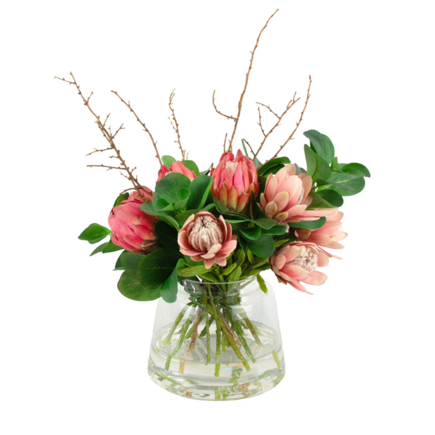 PROTEA MIX WITH FOLIAGE AND TWIG IN GLASS VASE