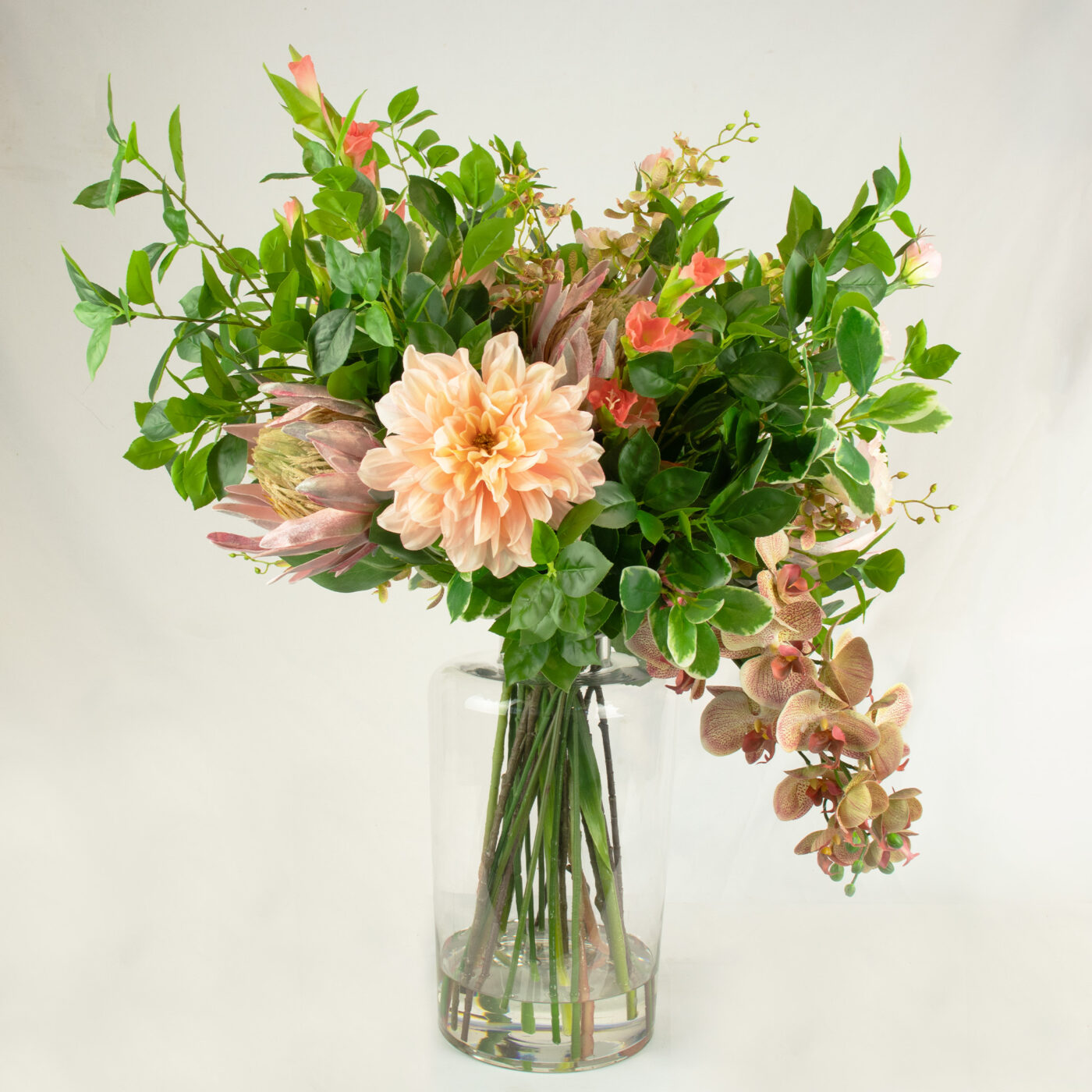 DELUXE BLUSH PINKS WITH FOLIAGE IN GLASS VASE