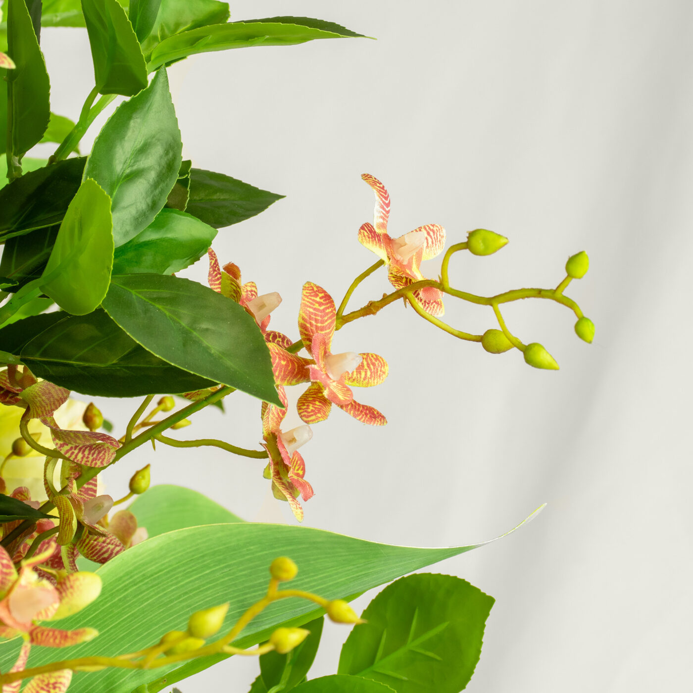 DELUXE LIME AND PINKS WITH FOLIAGE IN GLASS VASE