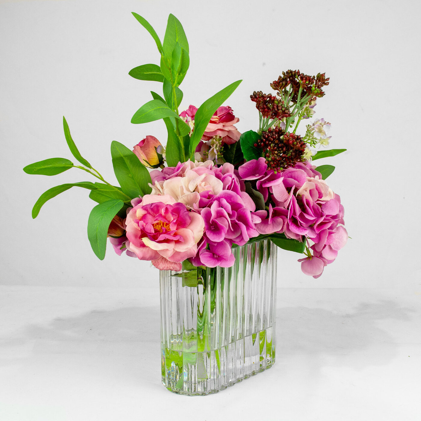 HYDRANGEA PINK WITH BERRY AND FOLIAGE IN RIBBED RECT VASE