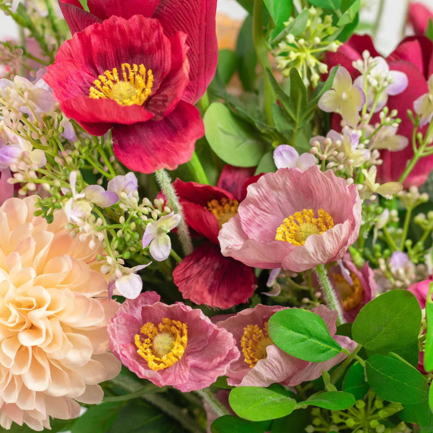 MIXED POPPIES TULIPS AND MUMS IN GLASS VASE