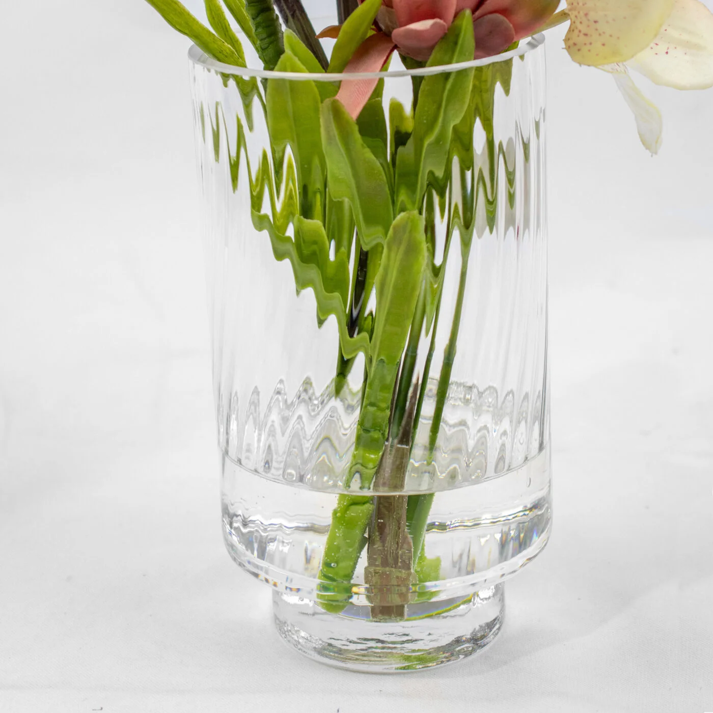 PROTEA CYMBIDIUM AND BANKSIA IN GLASS VASE