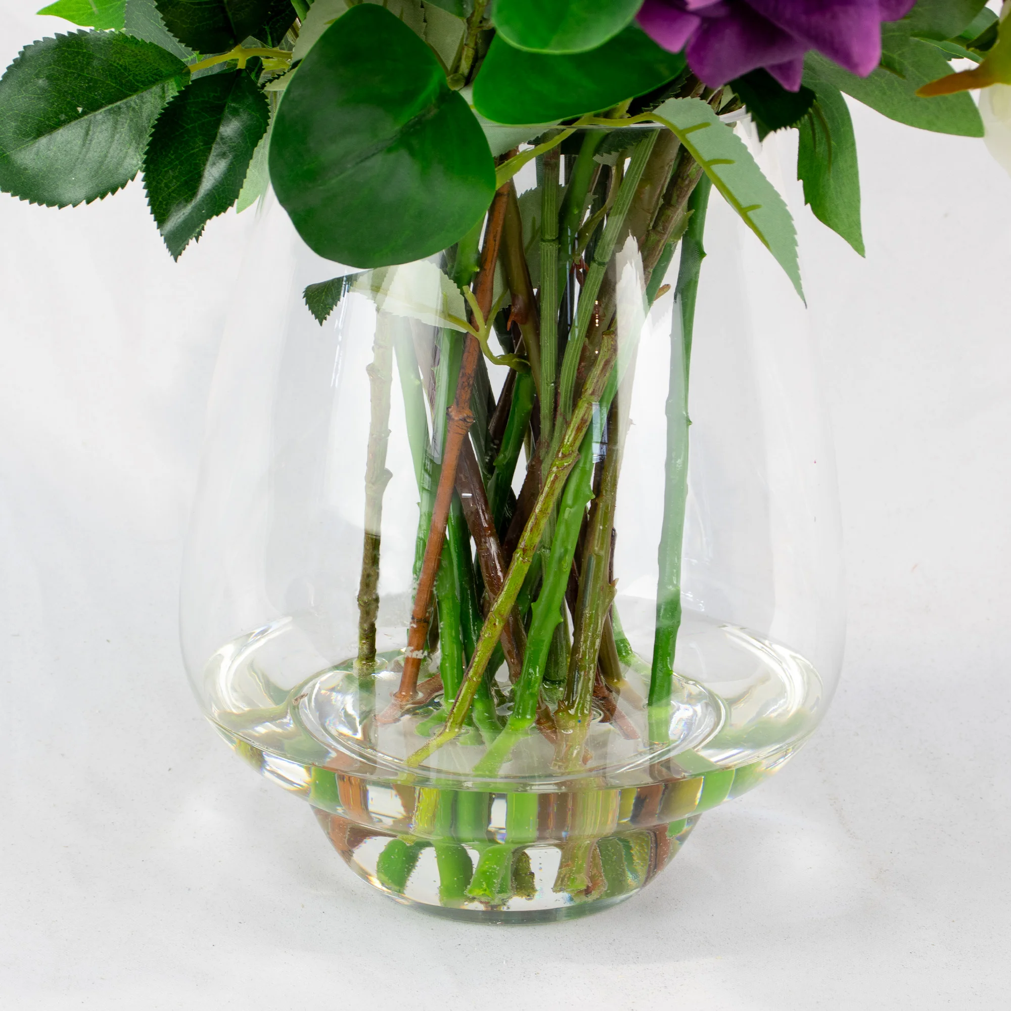 PURPLE, LAVENDER, REAL TOUCH ROSES WITH QUEEN ANNE LACE IN TULIP VASE