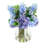MIXED BLUE HYDRANGEAS IN TULIP VASE