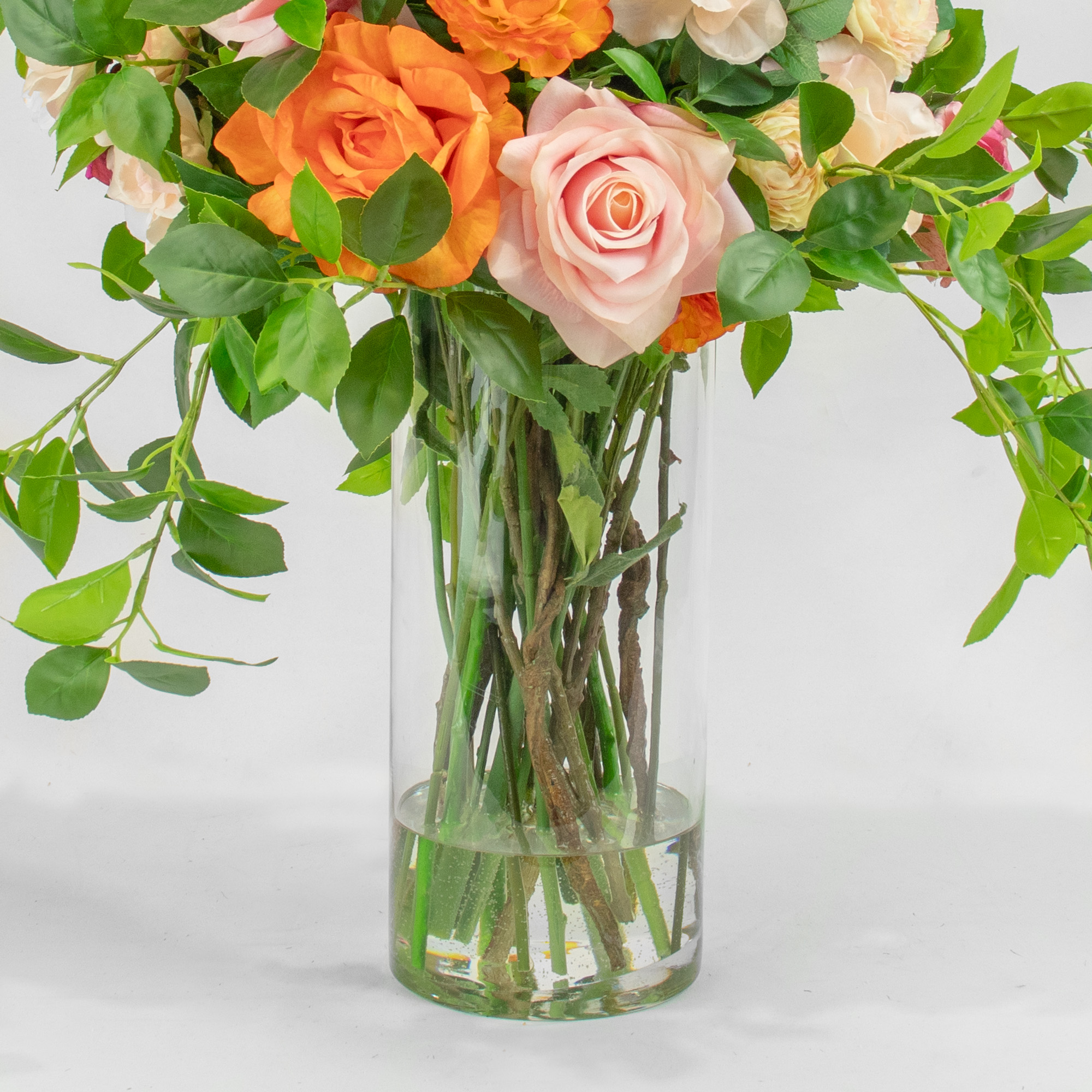 GARDEN MIX ROSES AND FOLIAGE IN CYLINDER VASE