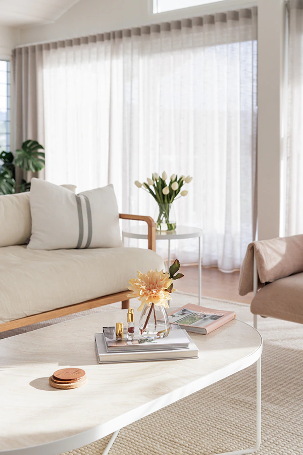 Silk by Design Dahlia floral diffuser in a lounge setting with white tulips in background