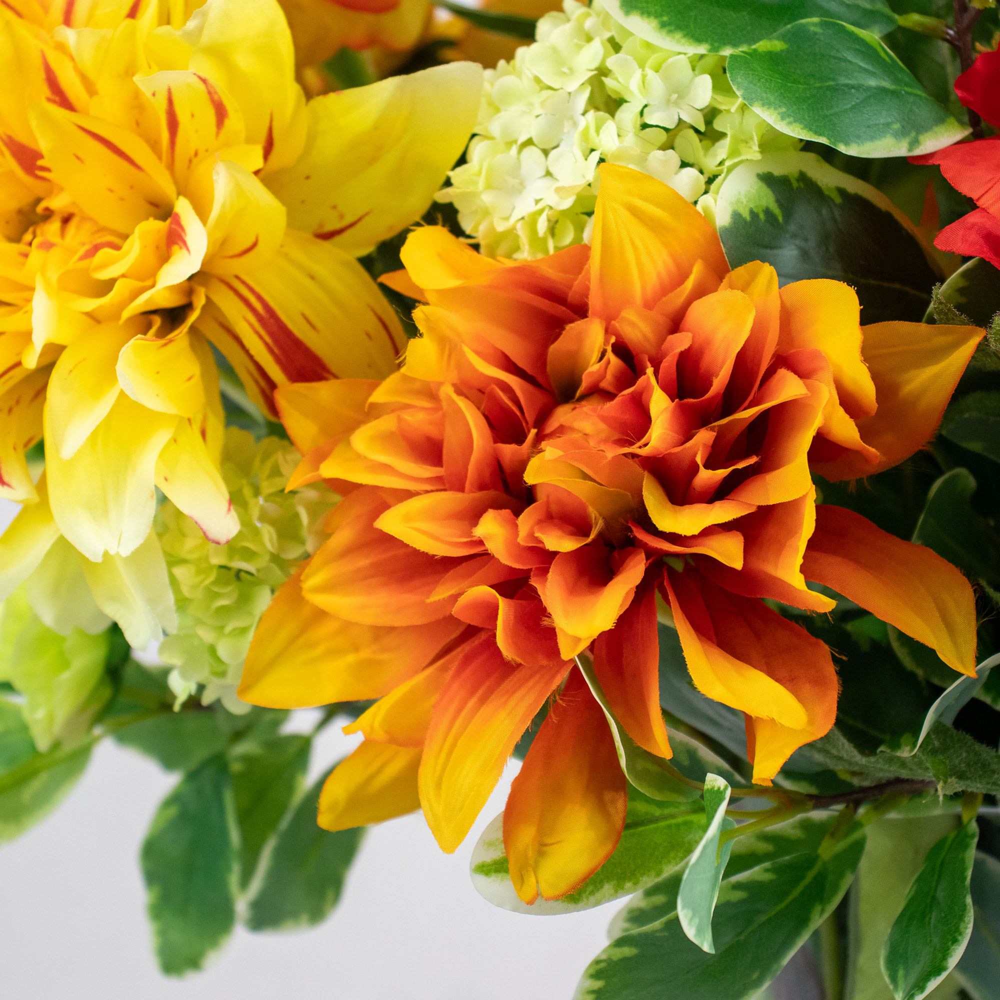 DAHLIA SUNRISE IN CONICAL GLASS VASE