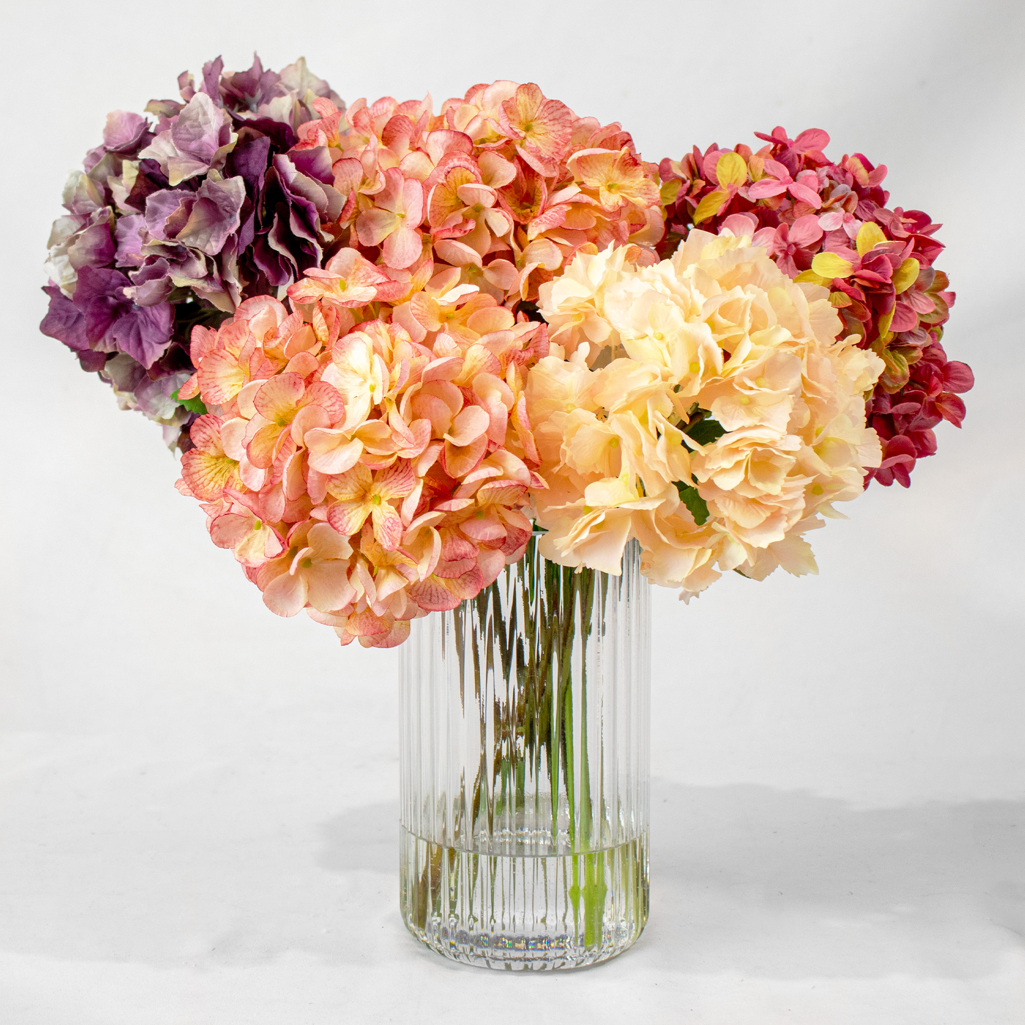 PINK & PURPLE HYDRANGEA MIX IN SML RIBBED CYL VASE