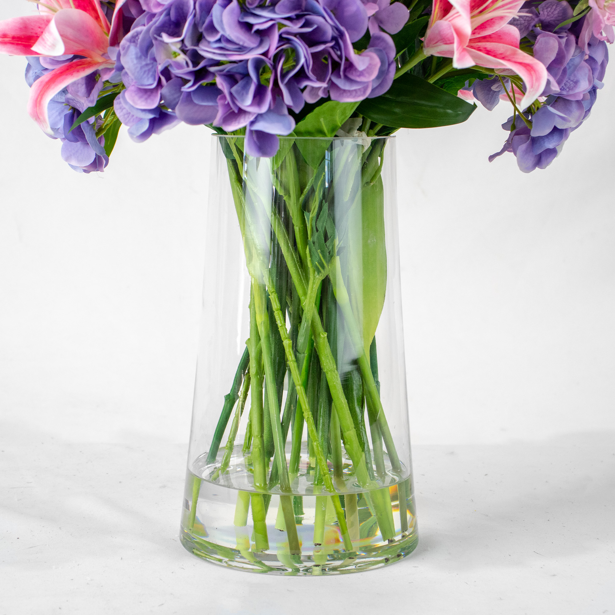 PINK TIGER LILY WITH PURPLE HYDRANGEA IN TAPERED VASE