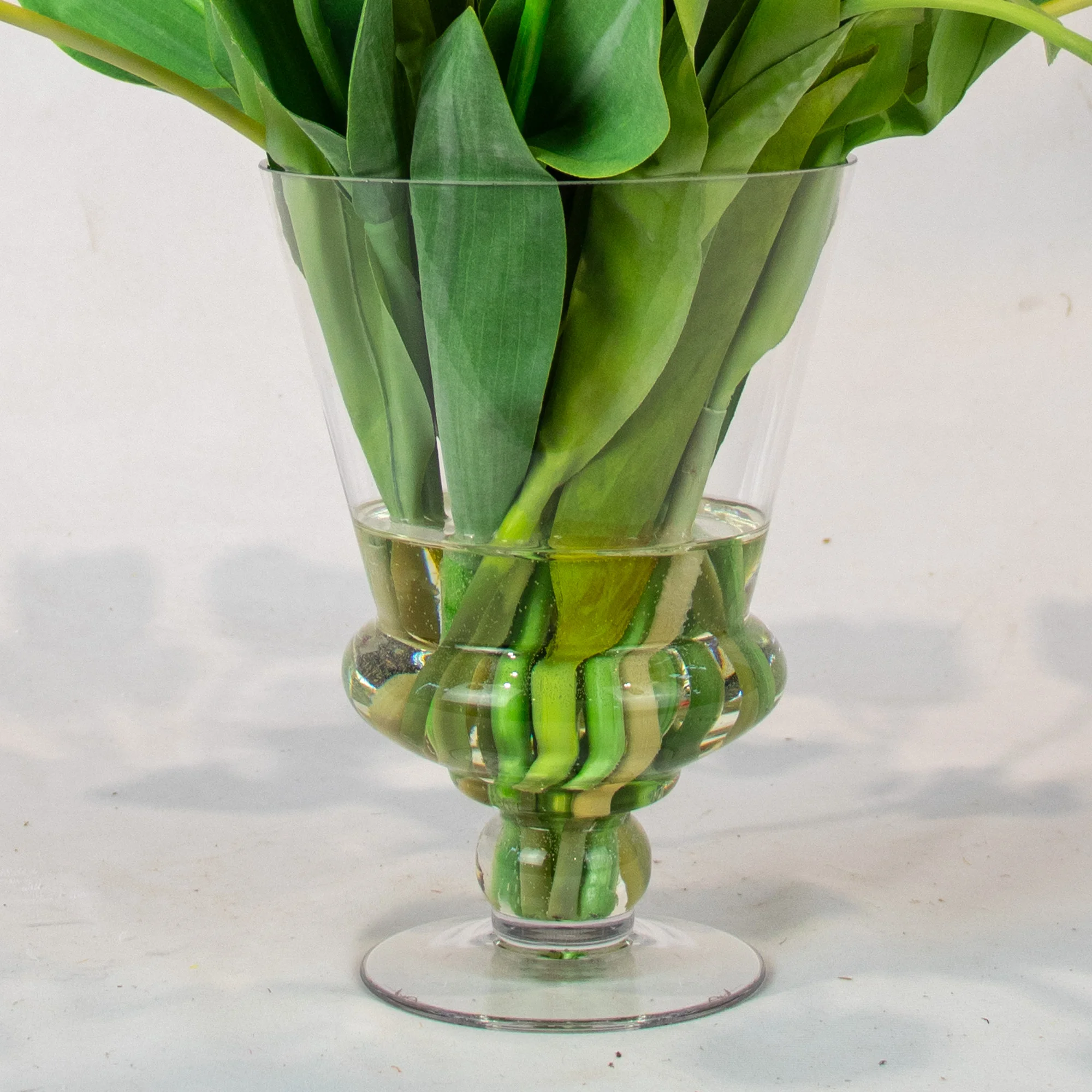 Large Vibrant Mixed Tulip Arrangement in Clear Glass Pedestal Vase