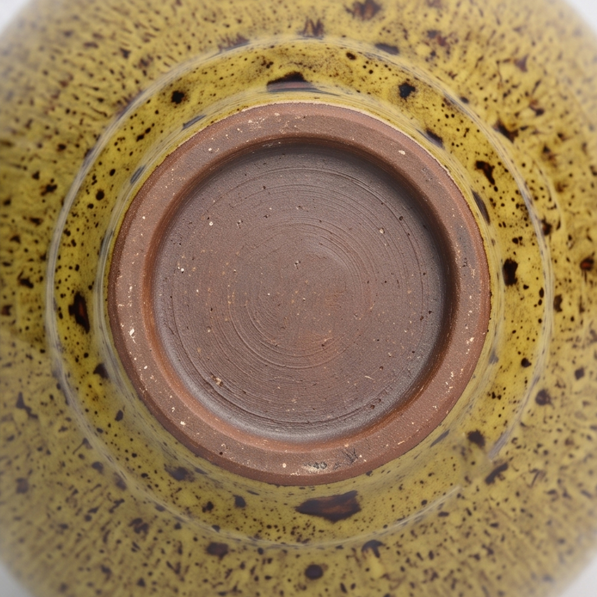Large 25.5cm leopard spot mustard ceramic jar with a ribbed texture styled on a wooden dining room sideboard.