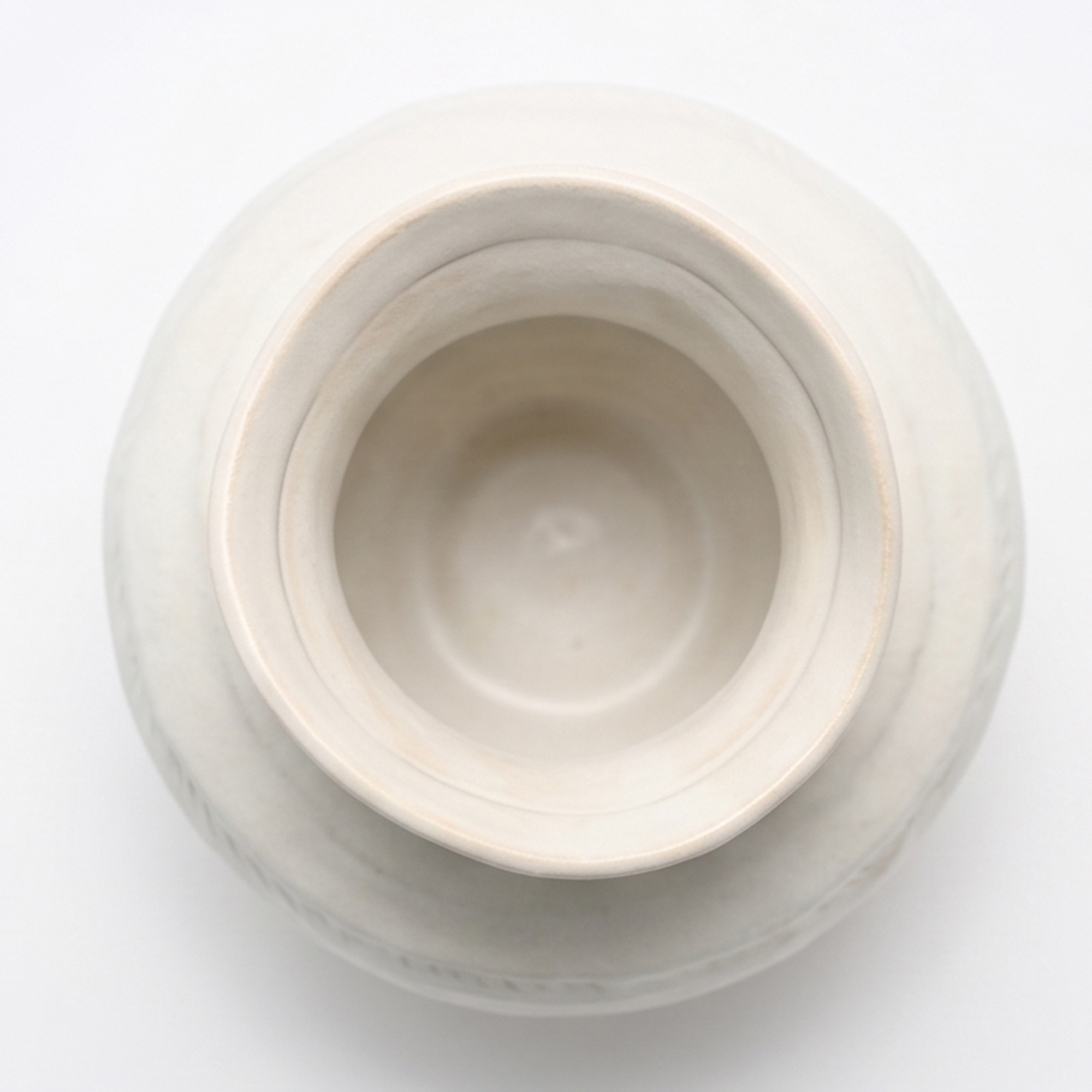 Large 22.2cm organic gourd off-white ceramic vase with a ribbed texture styled on a wooden dining room sideboard.