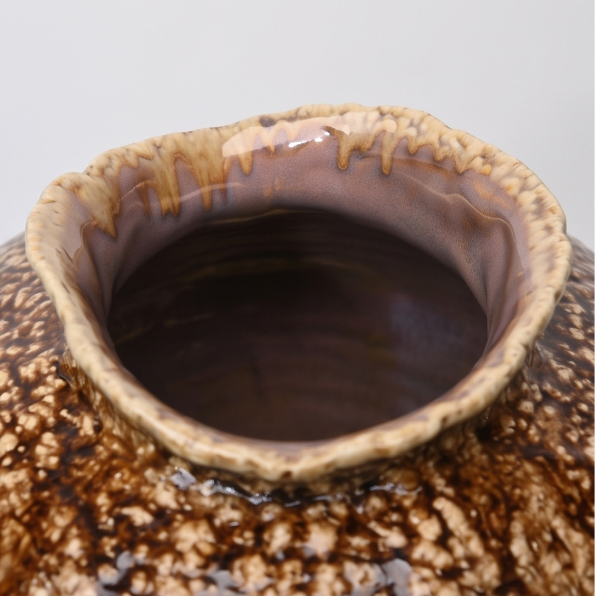 Extra extra large 52.5cm cream brown ceramic jar with a textured drip glaze styled on a wooden dining room sideboard.