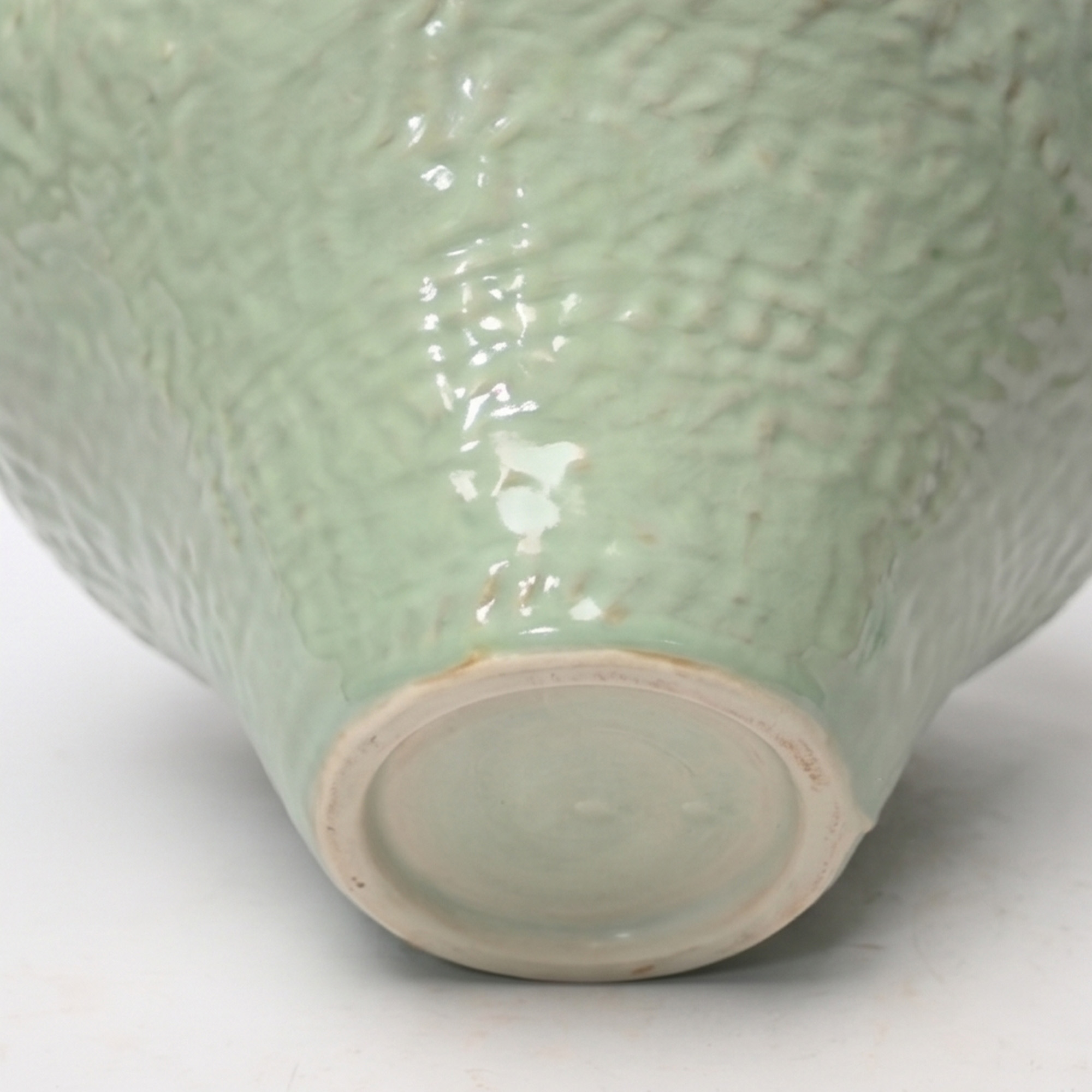Extra large 36.2cm dimpled duck egg ceramic pedestal vase with a glossy glaze styled on a wooden dining room sideboard.