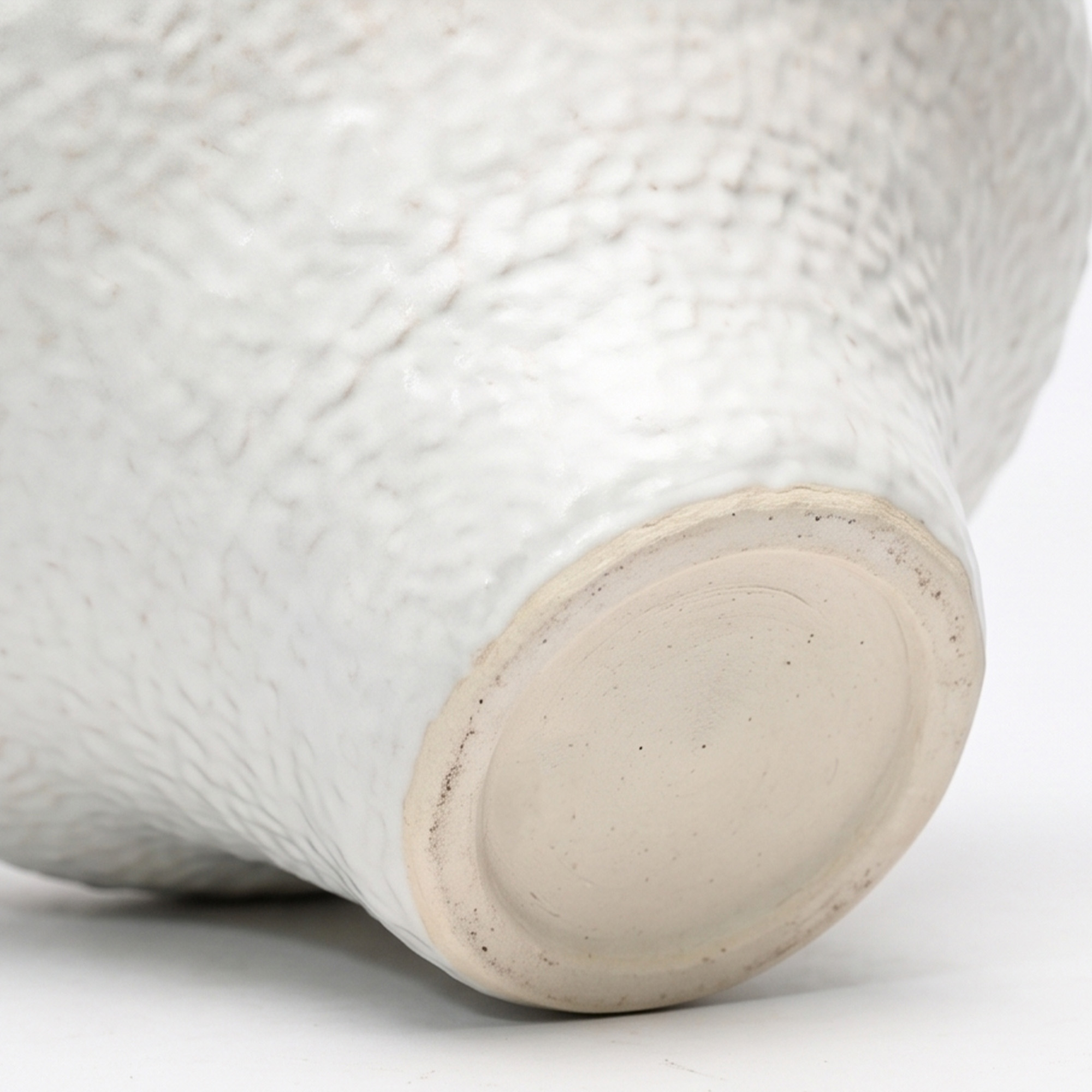 Extra large 36.2cm dimpled white ceramic pedestal vase with a glossy glaze styled on a wooden dining room sideboard.
