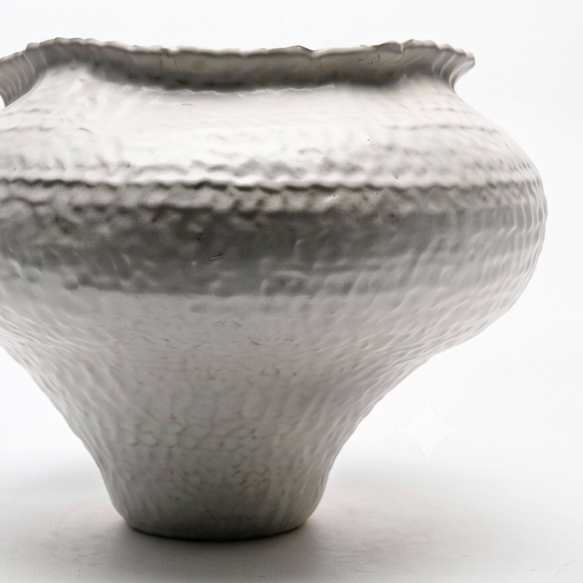 Extra large 36.2cm dimpled white ceramic pedestal vase with a glossy glaze styled on a wooden dining room sideboard.