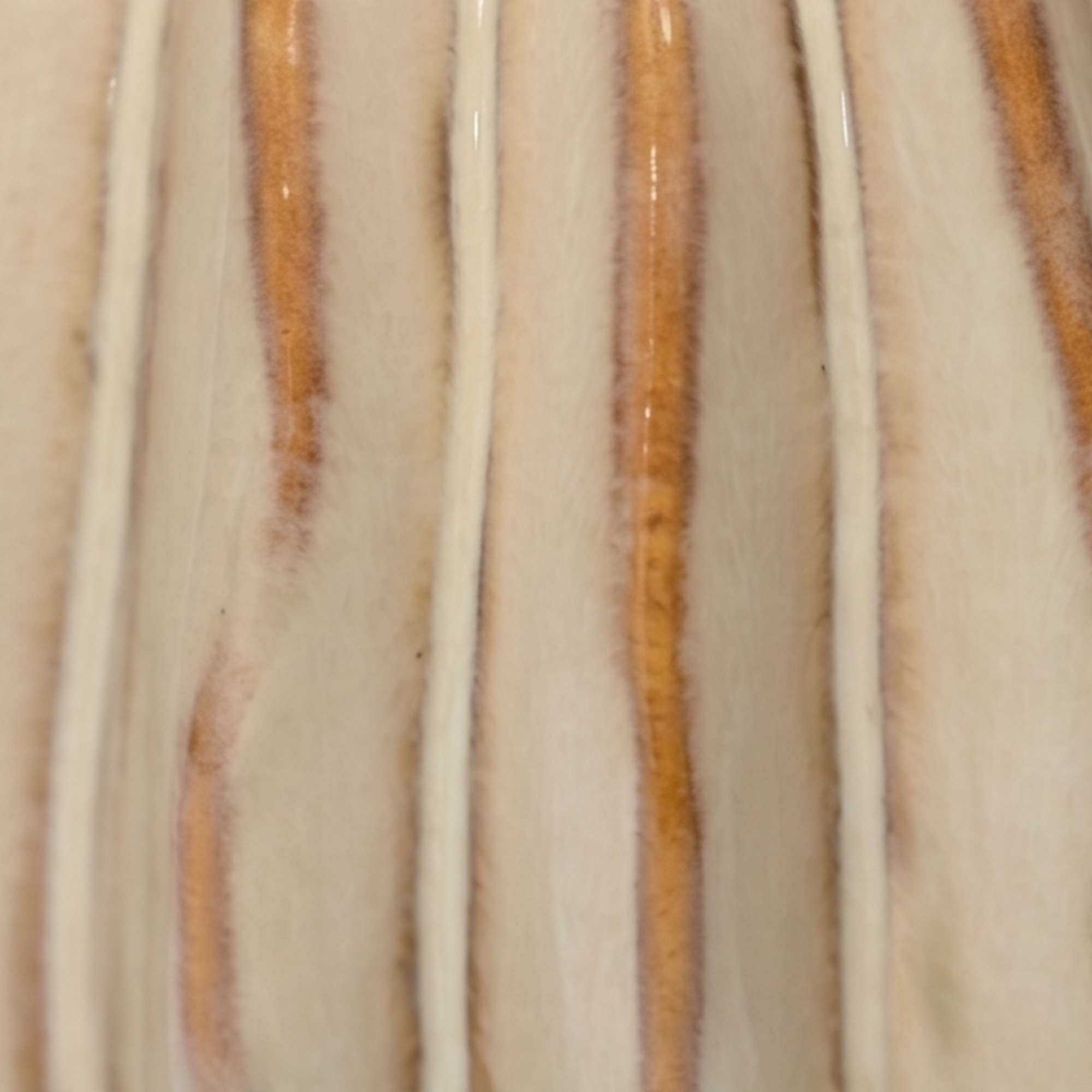 Medium 17.2cm ribbed cream ceramic bud vase with a glossy glaze styled on a wooden dining room sideboard.