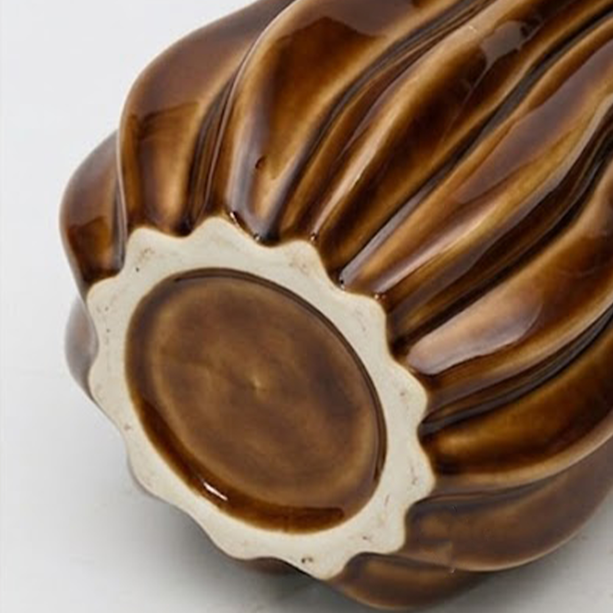 Medium 35.5cm fluted toffee ceramic pod vase with a glossy glaze styled on a wooden dining room sideboard.