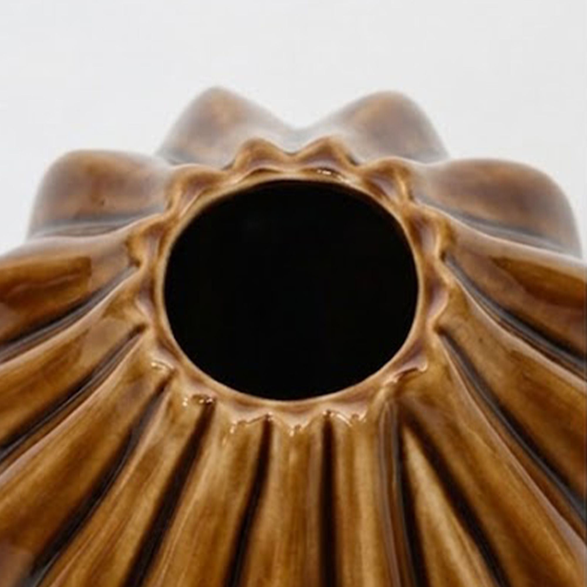 Medium 35.5cm fluted toffee ceramic pod vase with a glossy glaze styled on a wooden dining room sideboard.