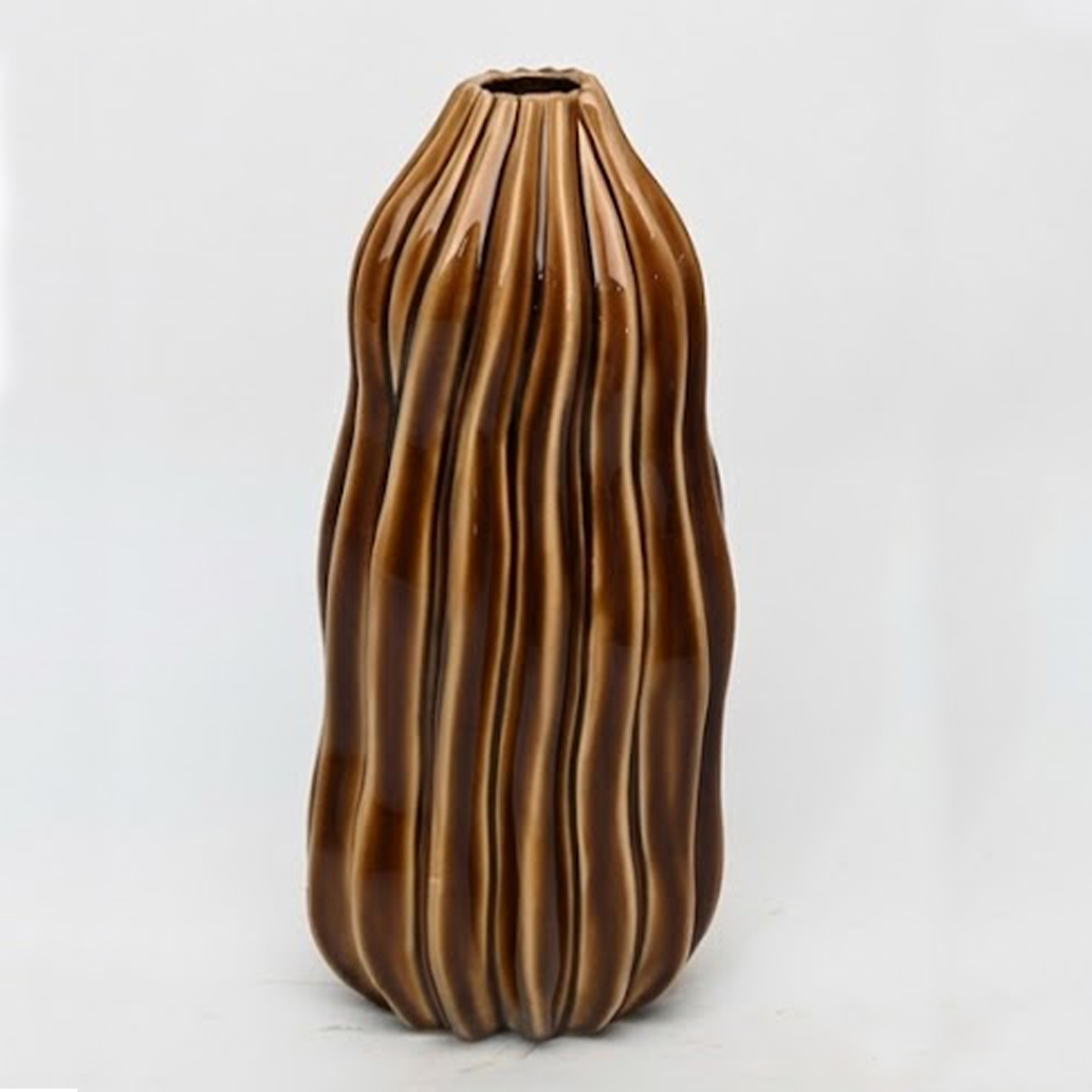 Medium 35.5cm fluted toffee ceramic pod vase with a glossy glaze styled on a wooden dining room sideboard.