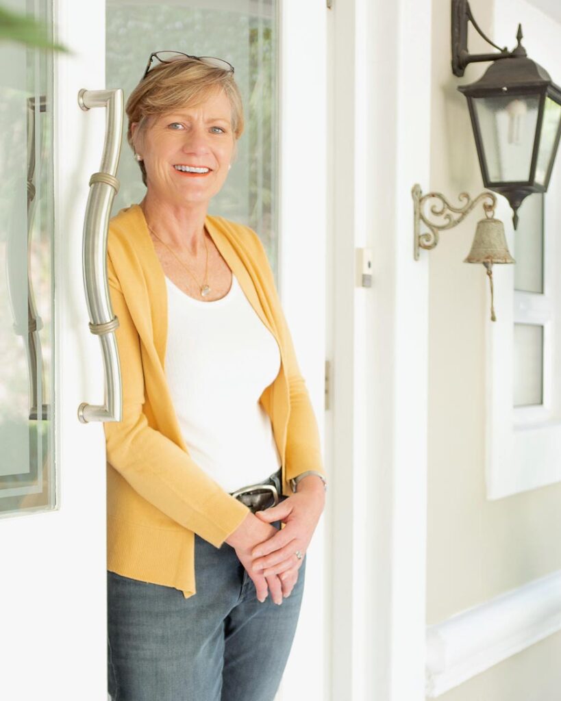Founder Sue Mcnair standing in the doorway.